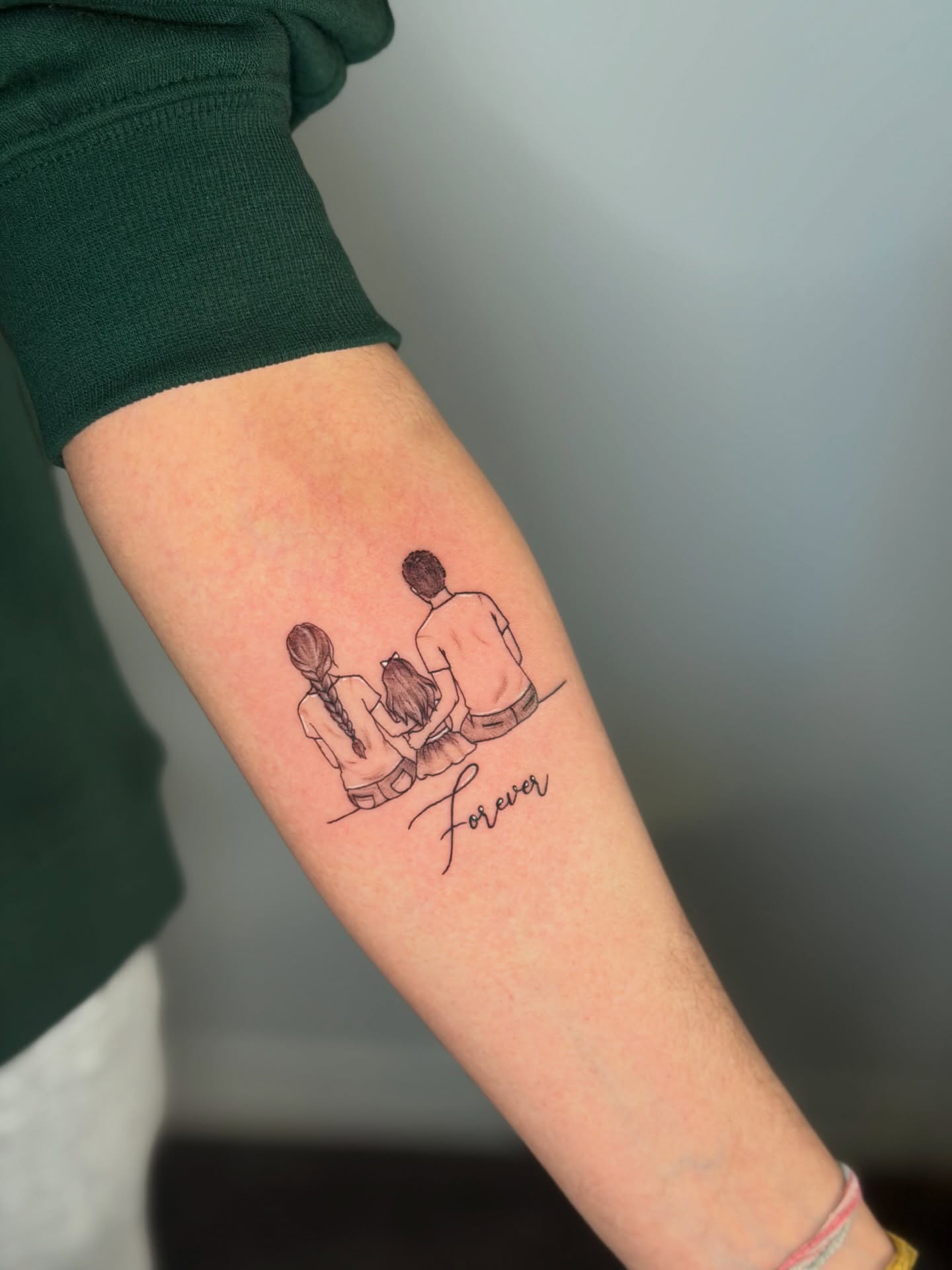 Couple walking fine line tattoo on the forearm by Mandy Kaur