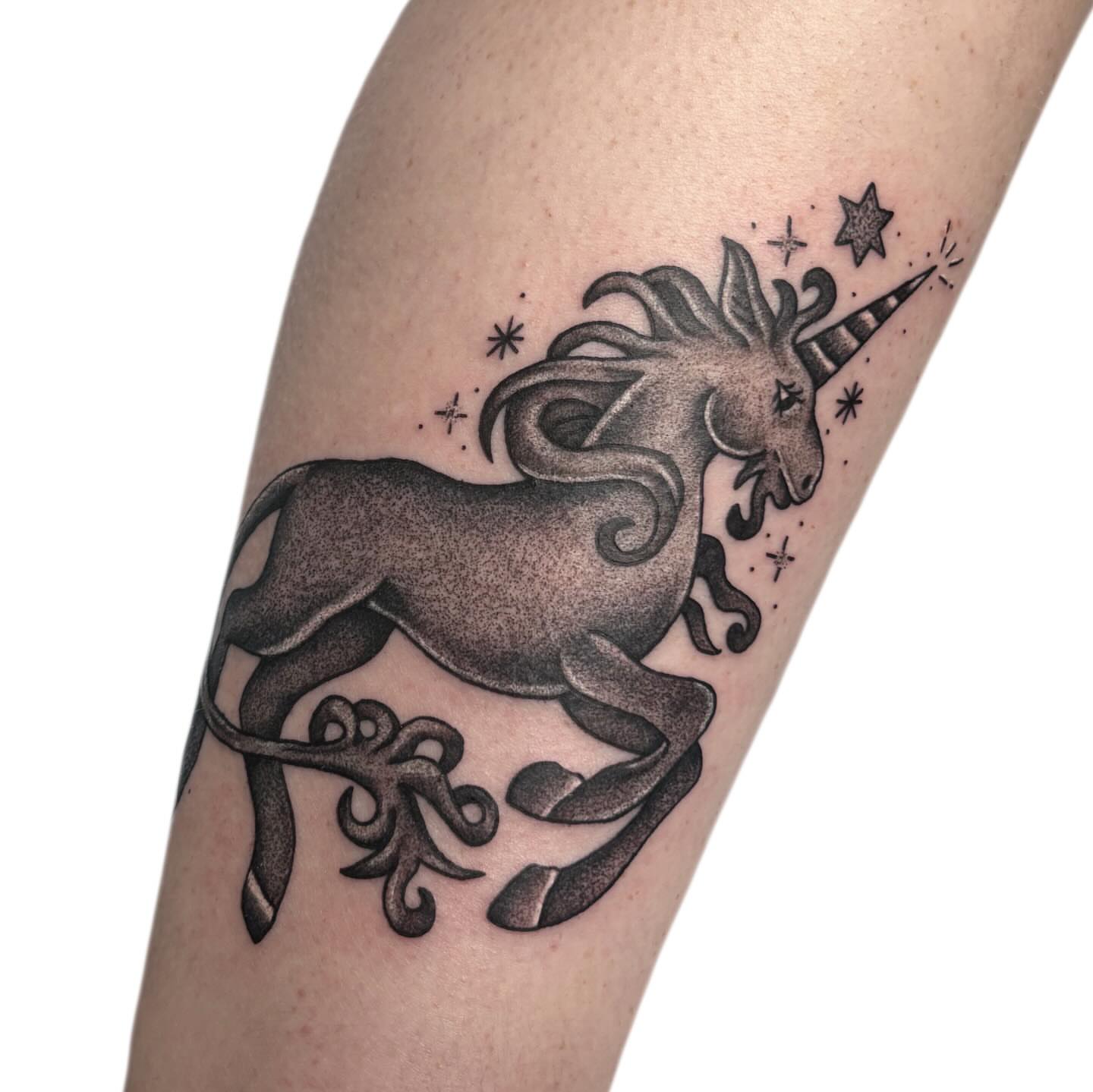 Unicorn black and grey tattoo on the forearm by Ava Brady Tattoos