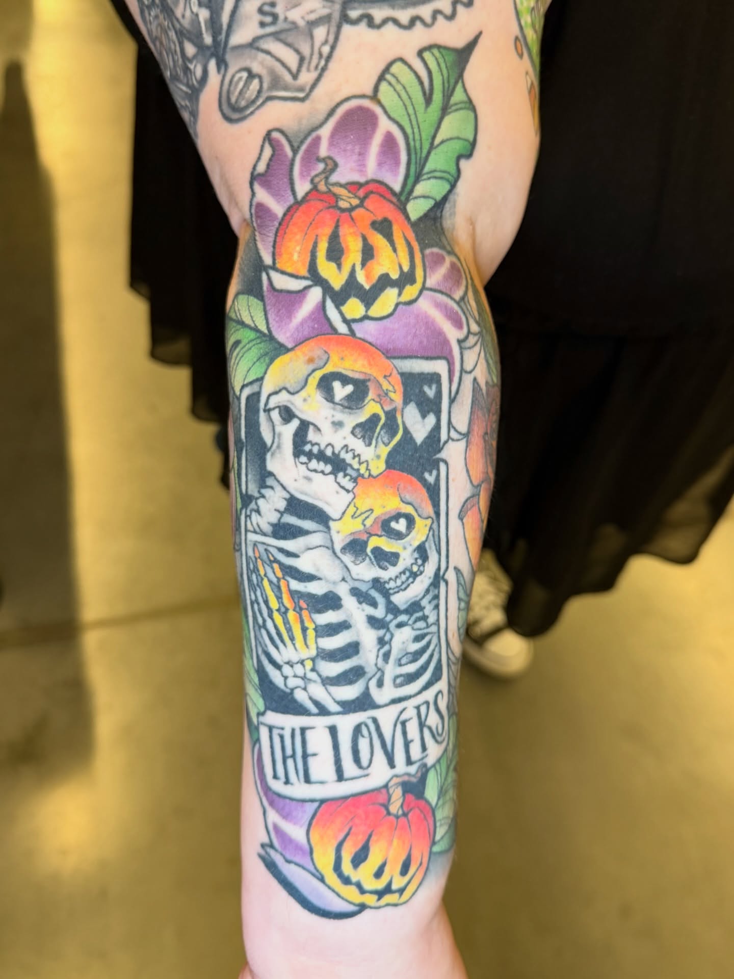 Skeleton couple American traditional tattoo on the forearm by Sam Castro