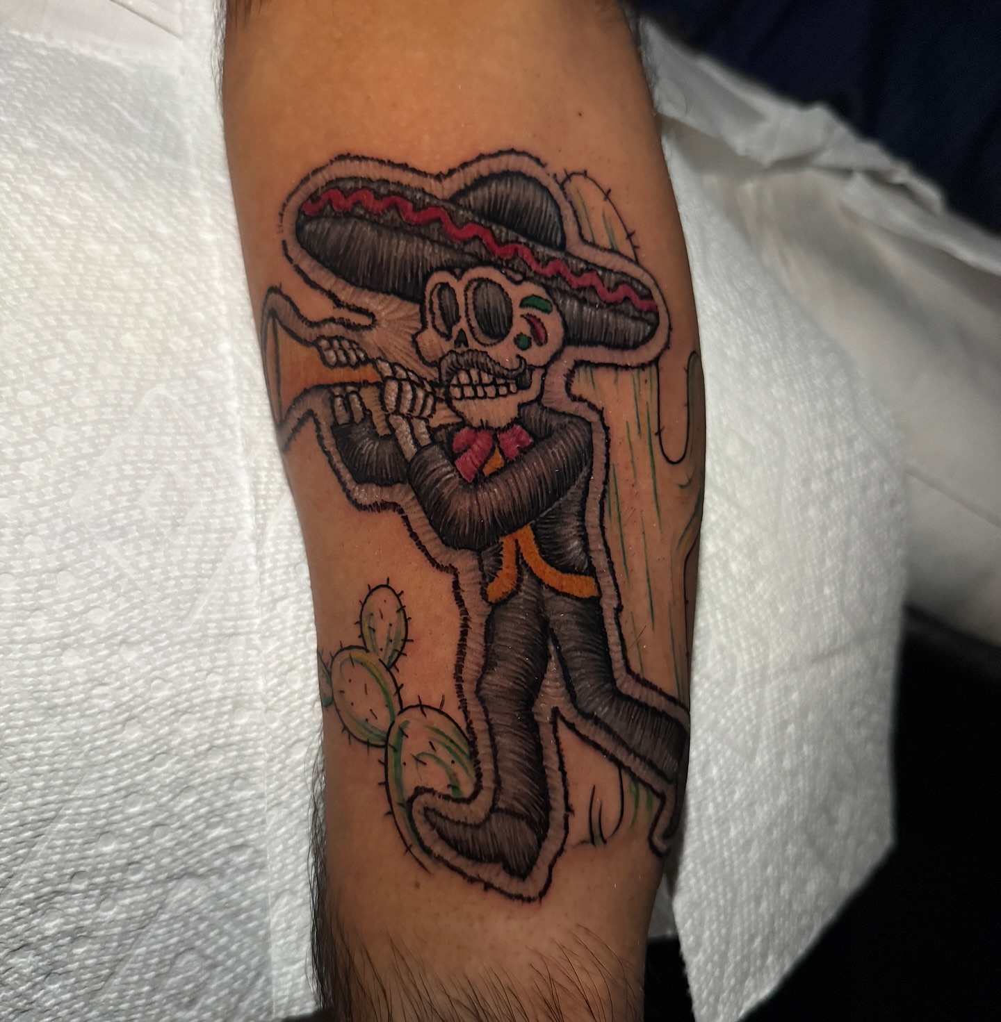 Sombrero-wearing skeleton Chicano tattoo on the forearm by @mexcellent_tattoos