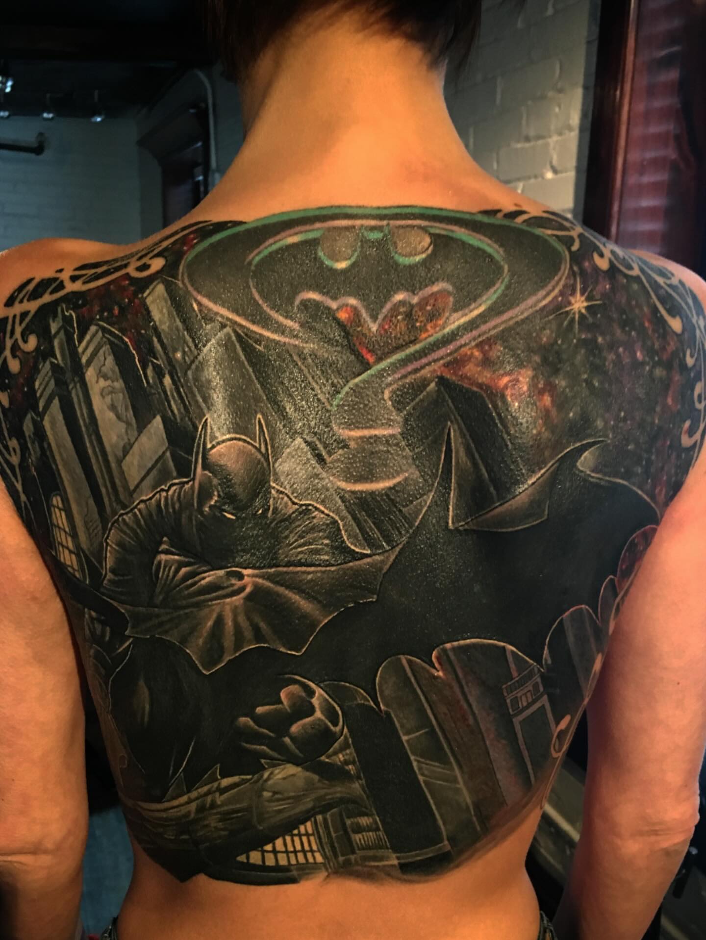 Batman dark realism tattoo on the back by Patrick Delvar