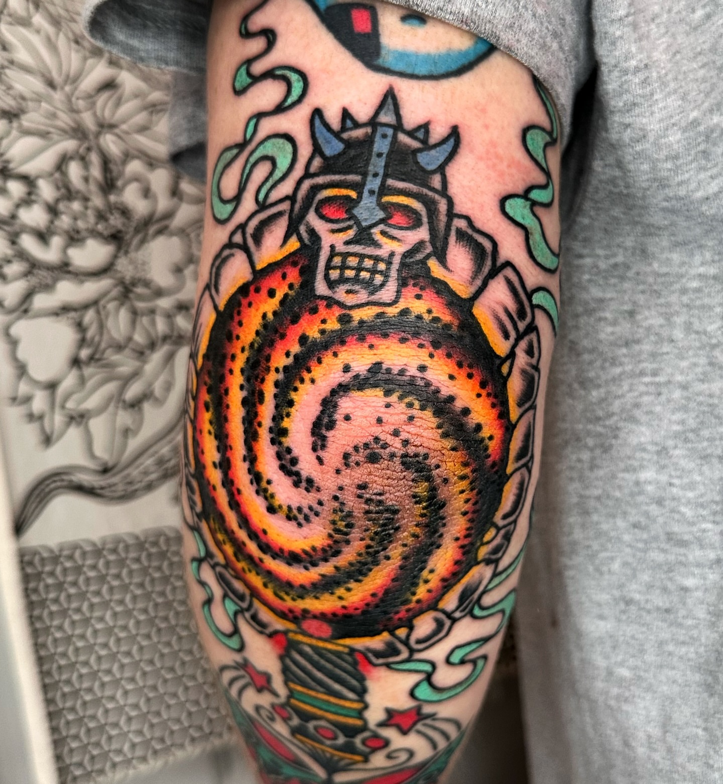 Robotic skull with swirling vortex dotwork tattoo on the forearm by Brock Johnson
