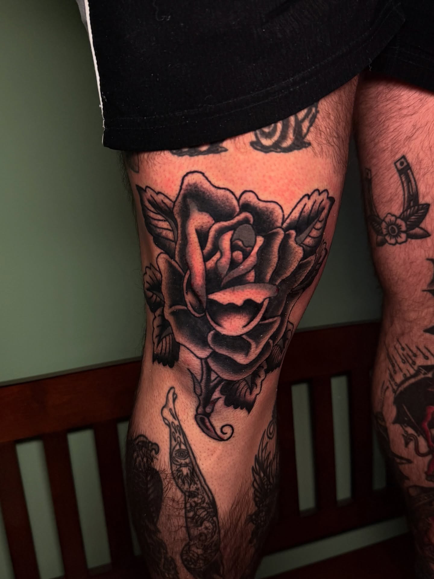 Rose American traditional tattoo on the thigh by Stevie Lowenstein, Cincinnati, Ohio