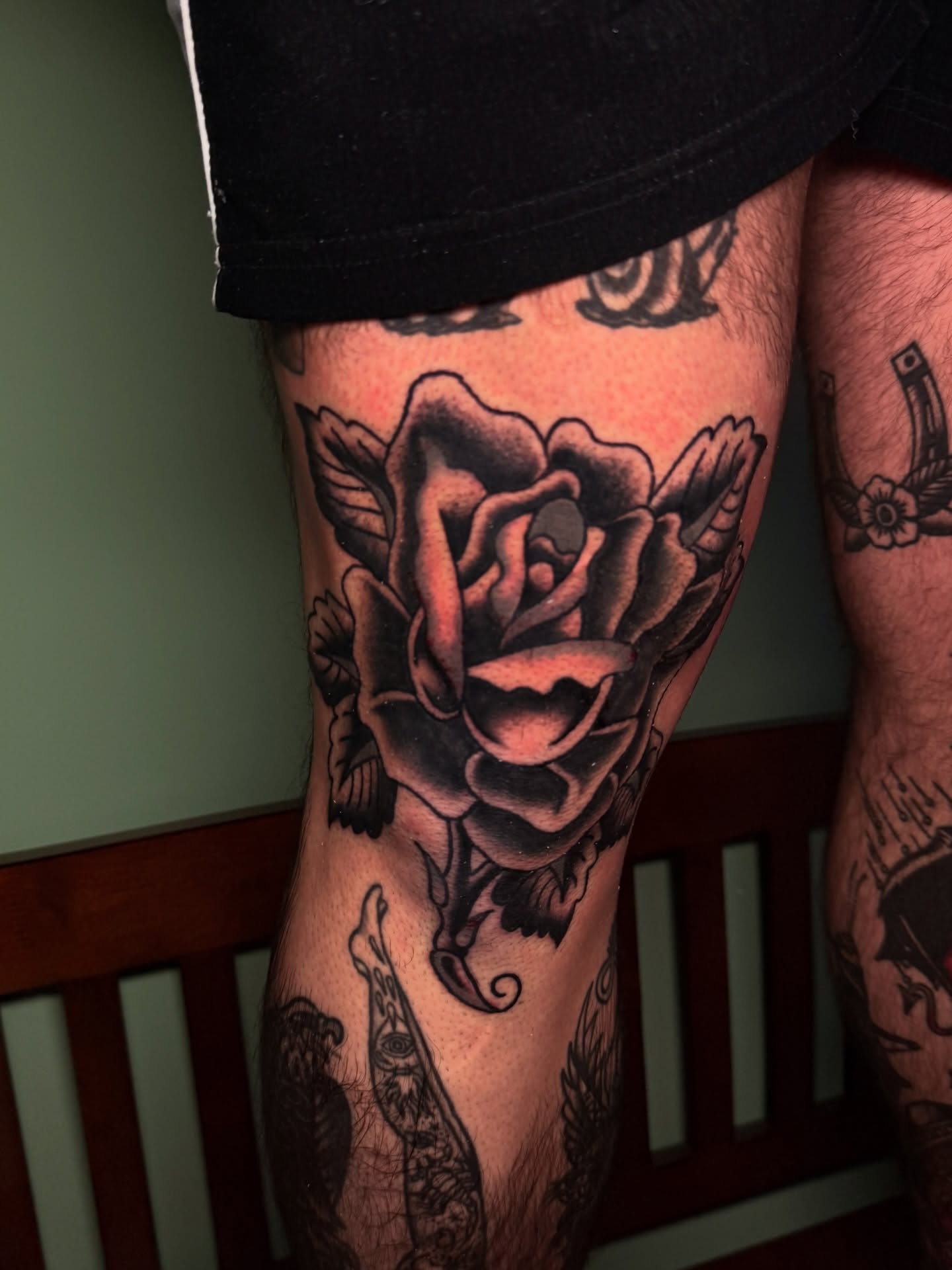 Rose black and grey tattoo on the thigh by Stevie Lowenstein, Cincinnati, Ohio