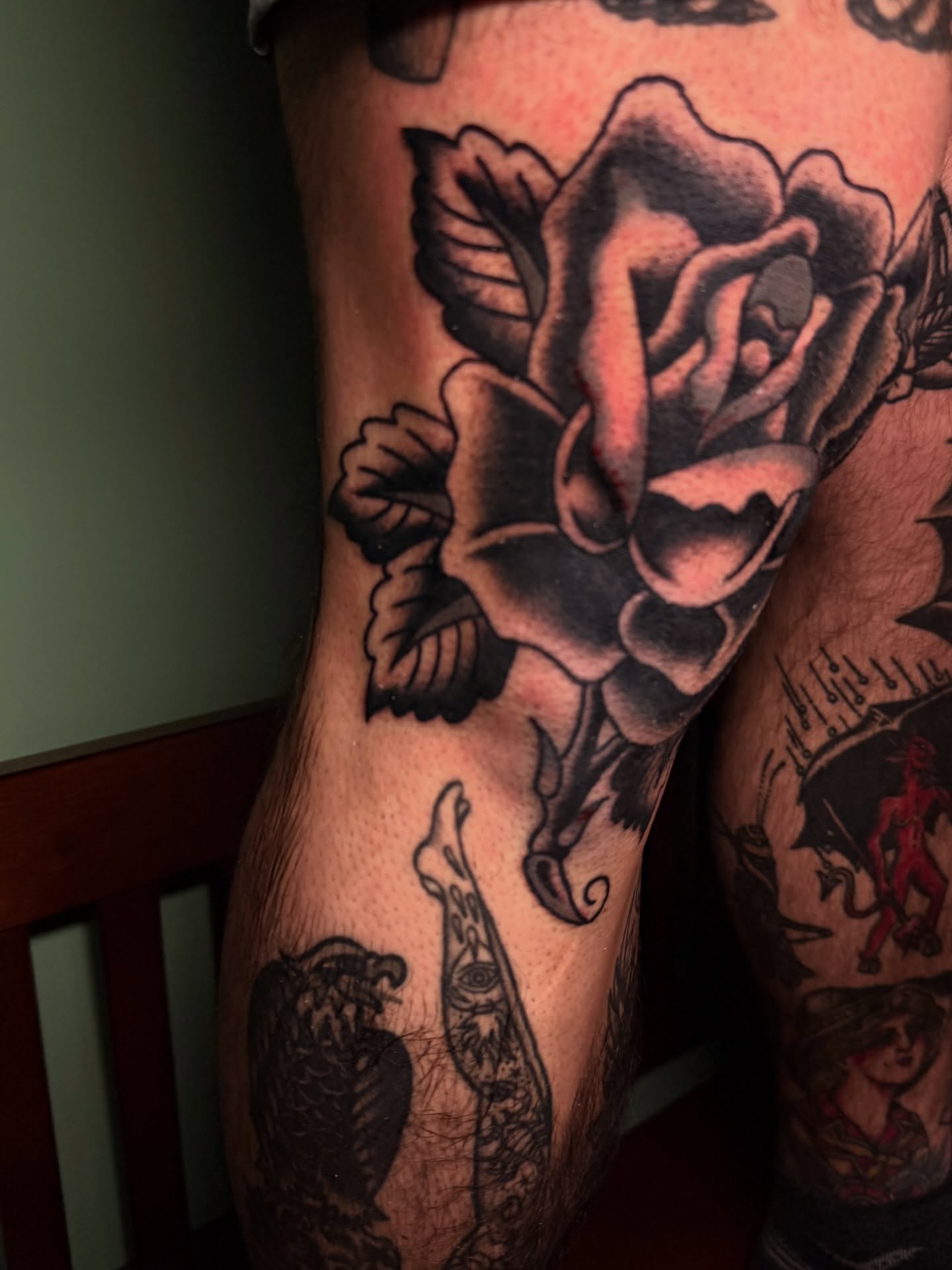 Rose American traditional tattoo on the leg by Stevie Lowenstein, Cincinnati, Ohio