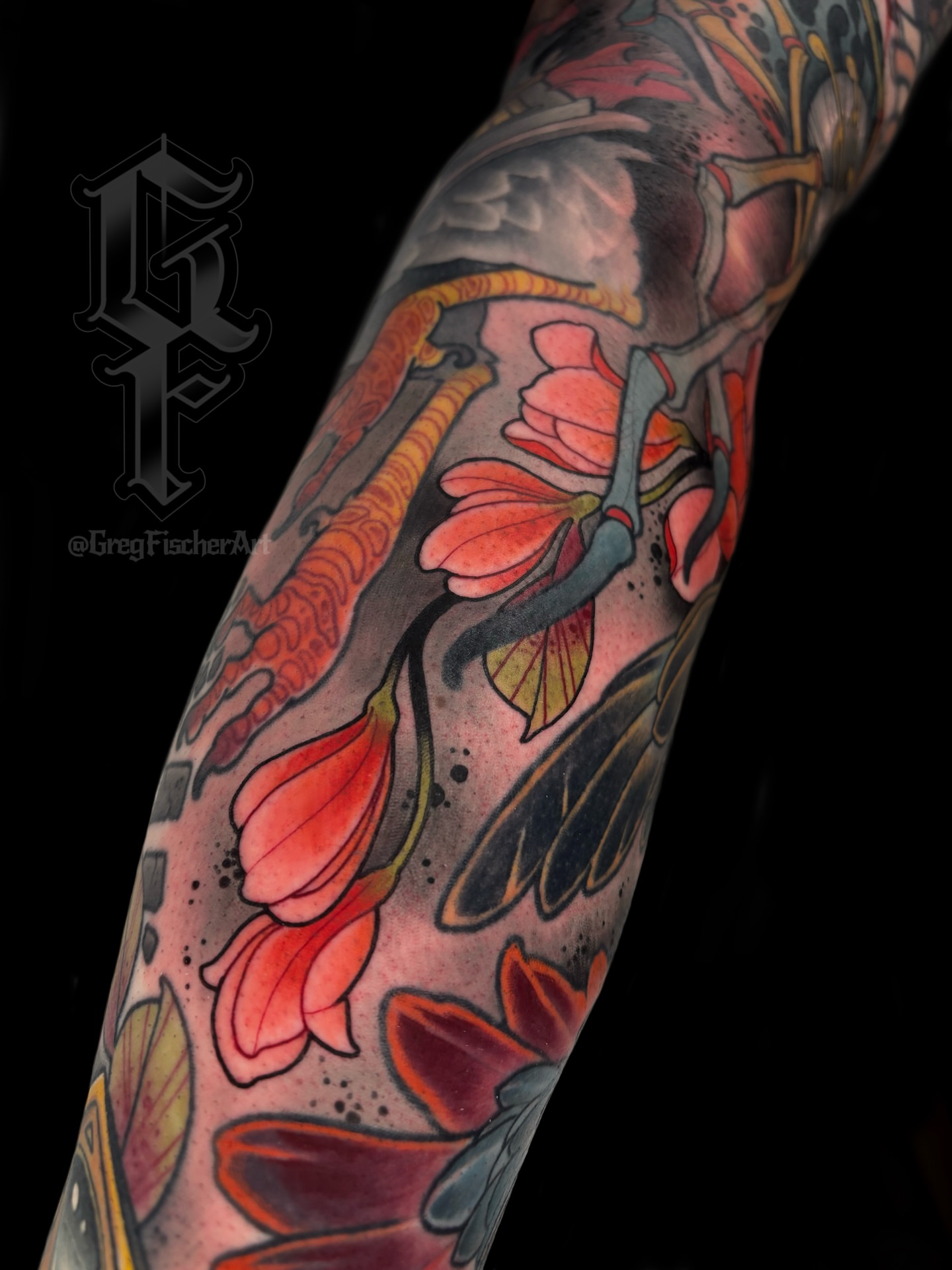 Flowers and dragonfly American traditional tattoo on the forearm by Greg Fischer