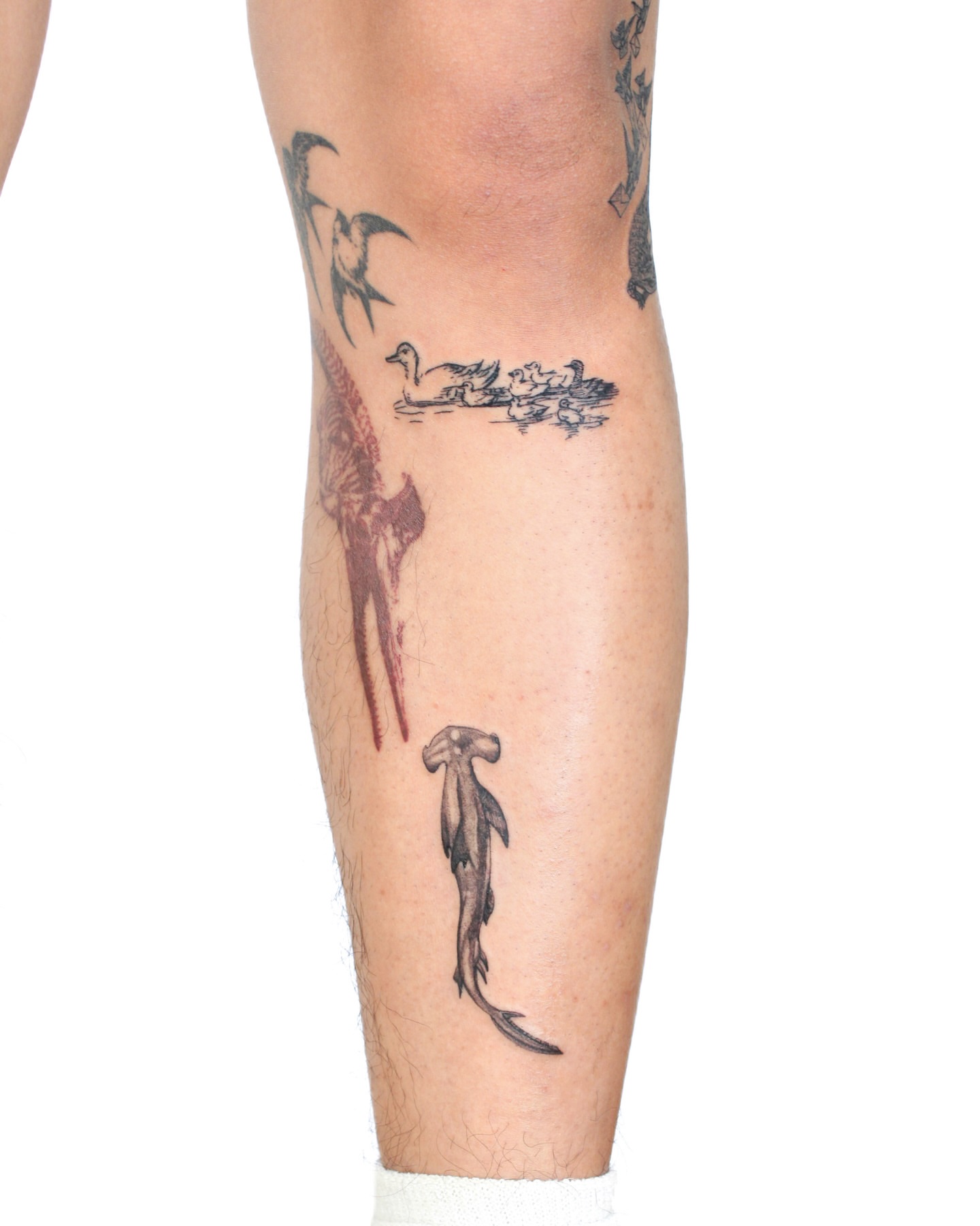 Ducks and birds black and grey tattoo on the calf by Tatmostat