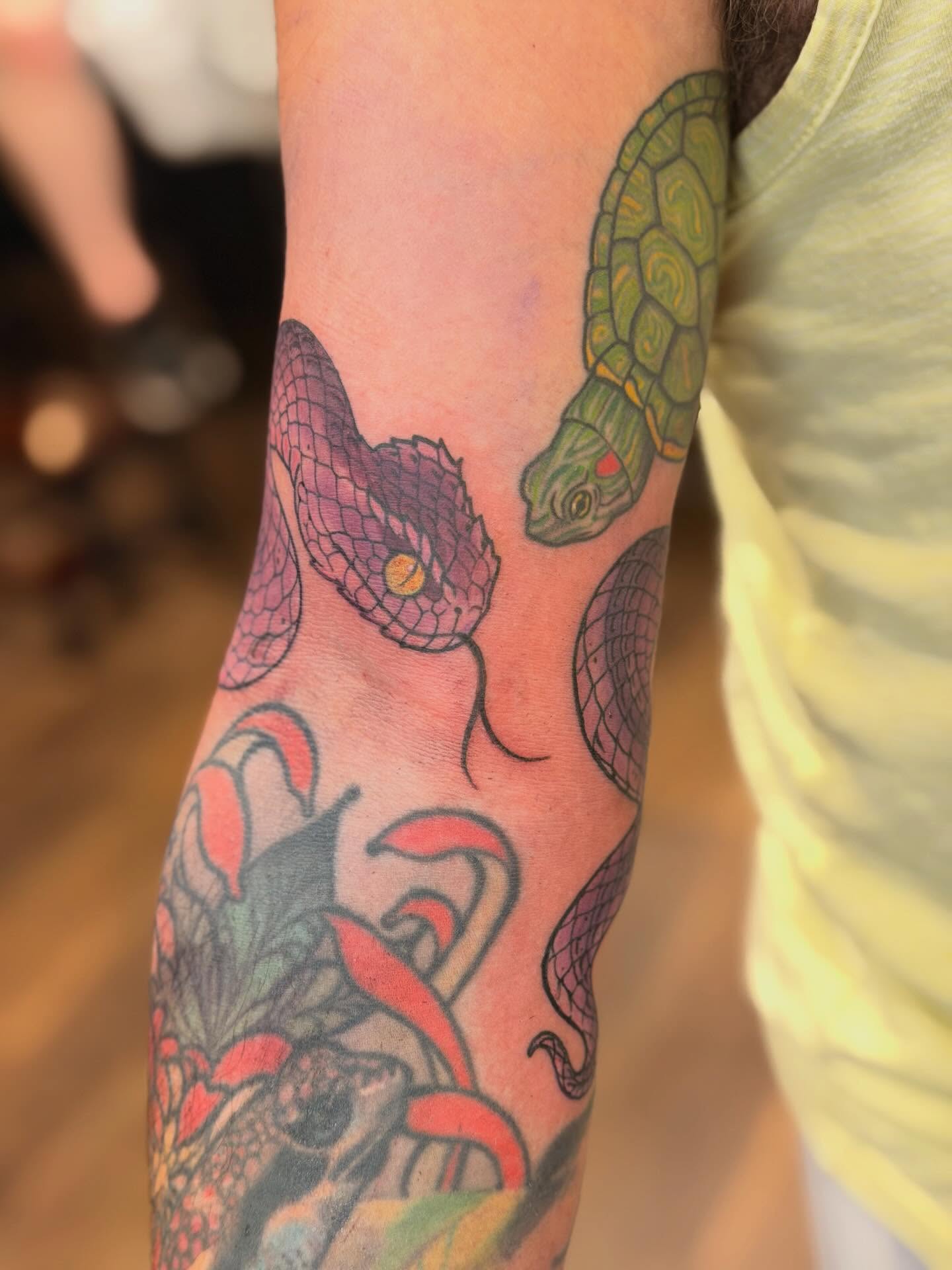 Snake and turtle American traditional tattoo on the forearm by English Cousins, Nashville, Tennessee