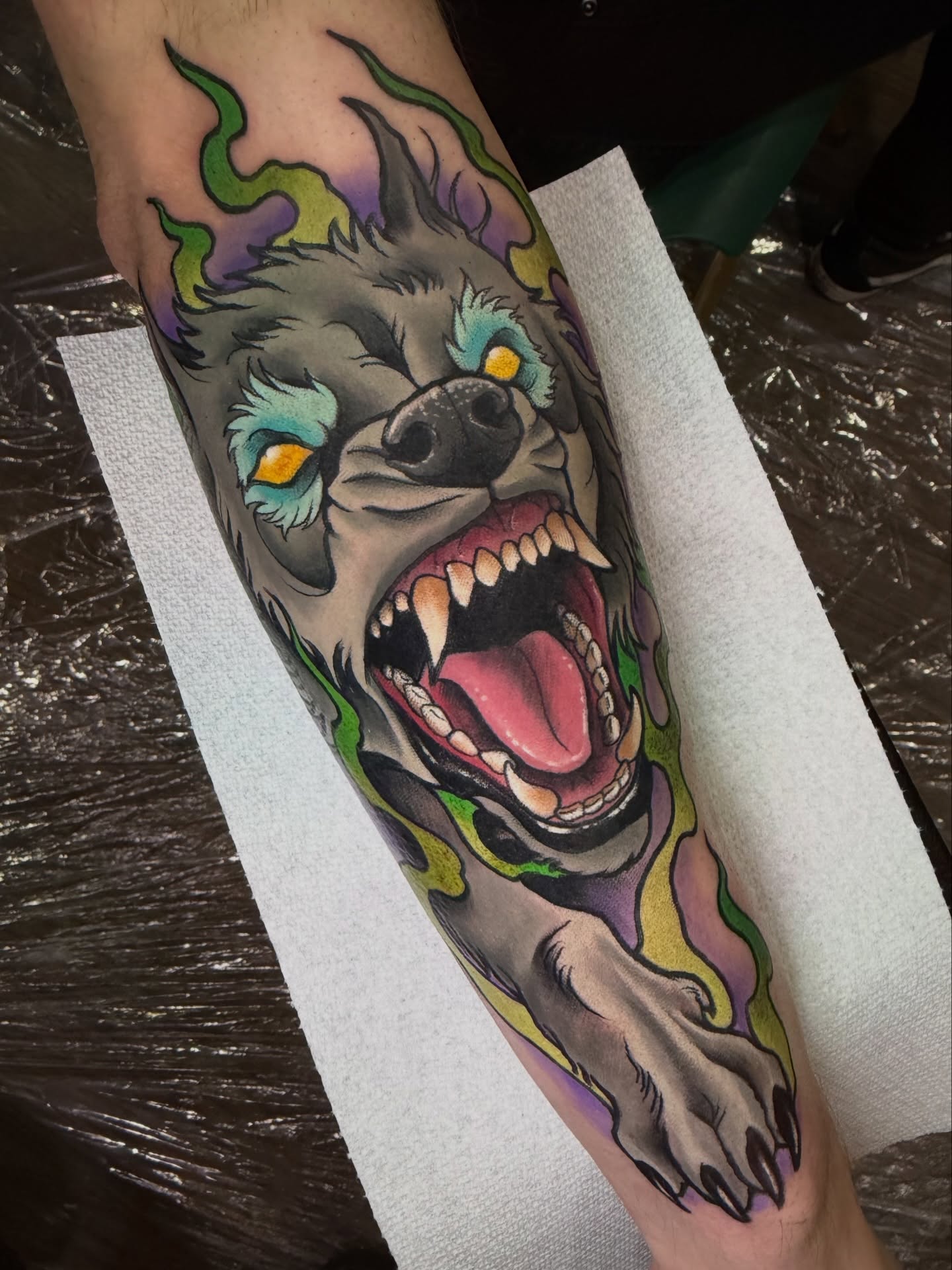 Wolf American traditional tattoo on the forearm by James Mullin