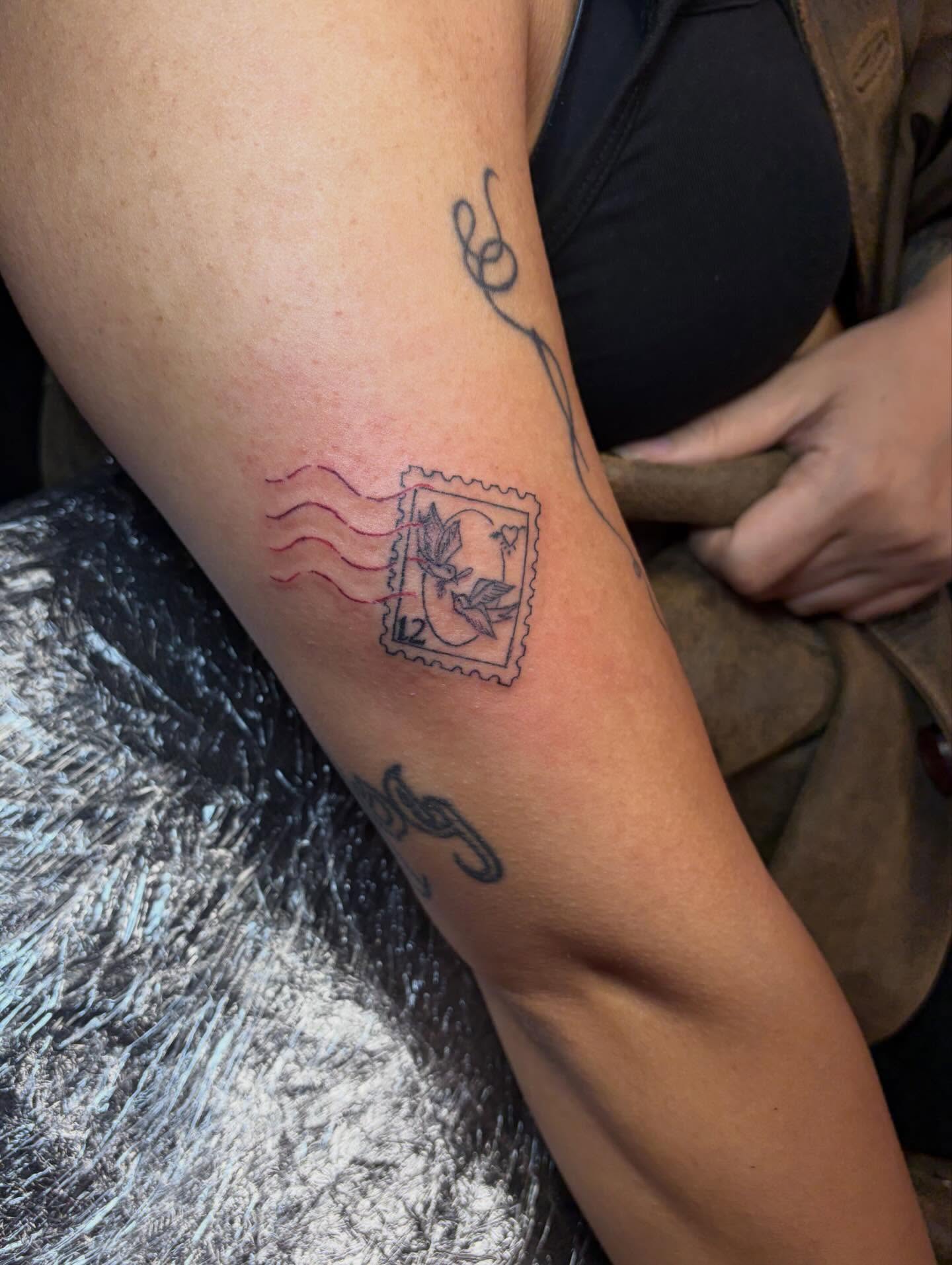 Postage stamp black and grey tattoo on the forearm by Vegas Tattoo Mommy ๐๐, Las Vegas, Nevada