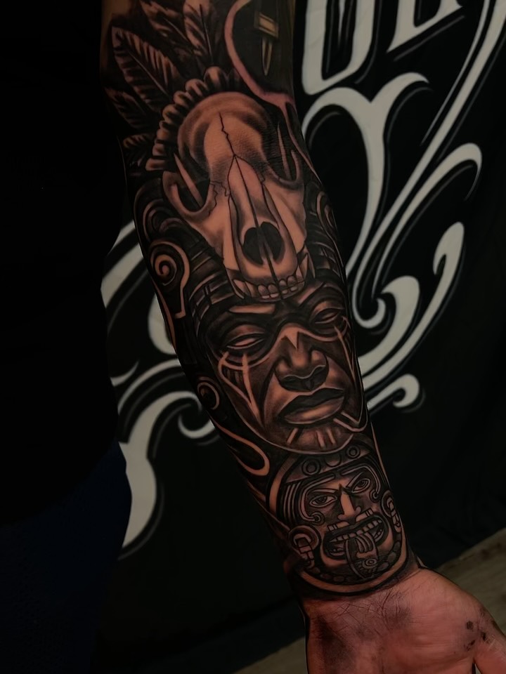 Mask realism tattoo on the forearm by Daniel Michael Perez
