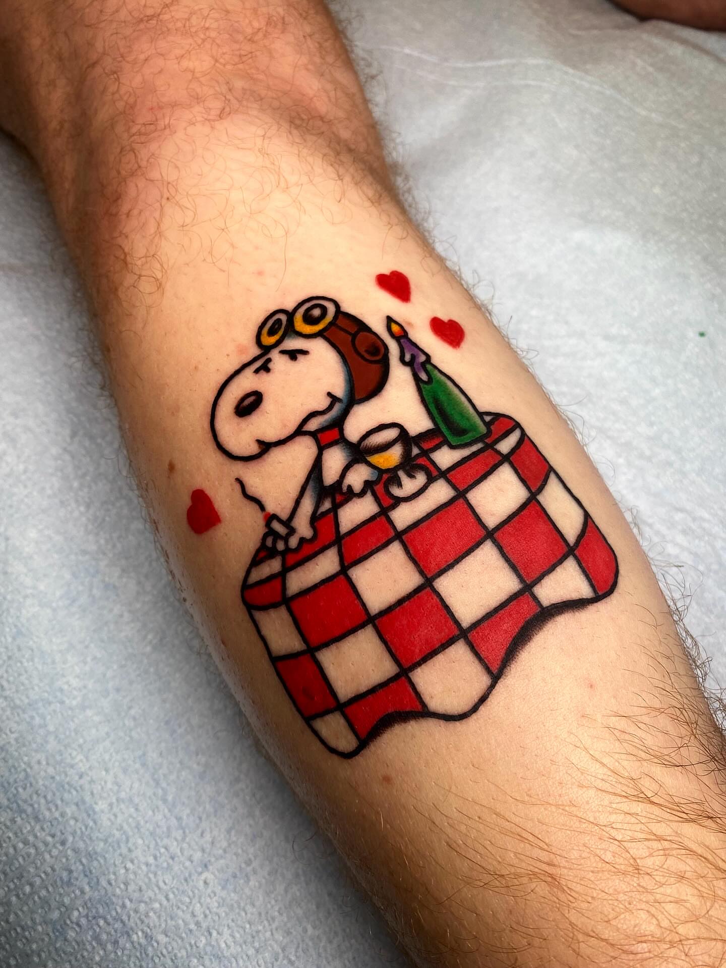 Snoopy illustrative tattoo on the forearm by @rubber_band_dan, San Francisco, California