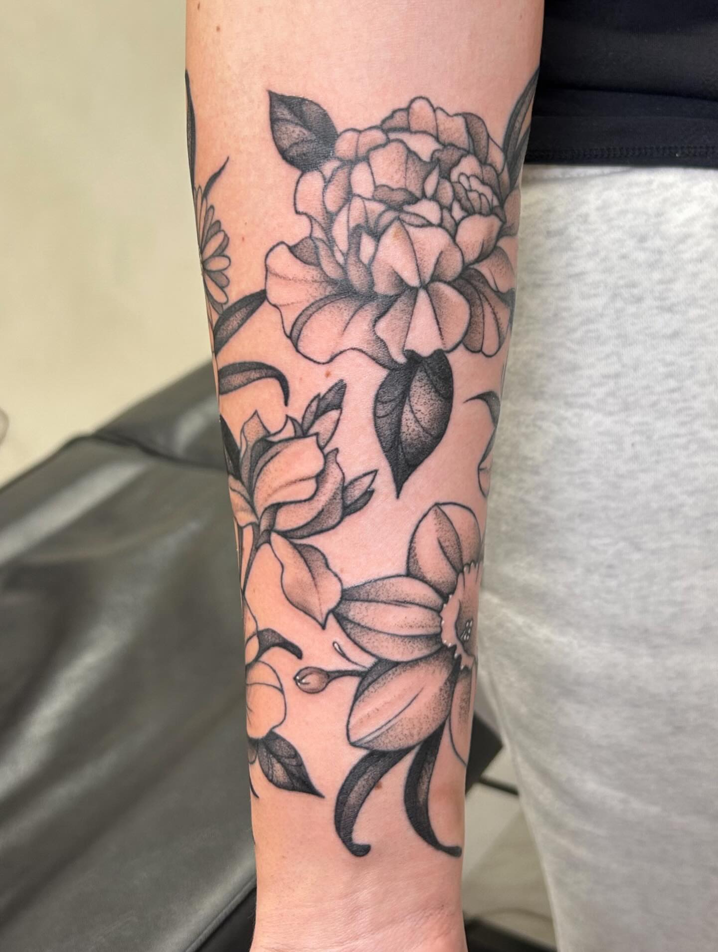 Peony flowers dotwork tattoo on the forearm by kuna ink