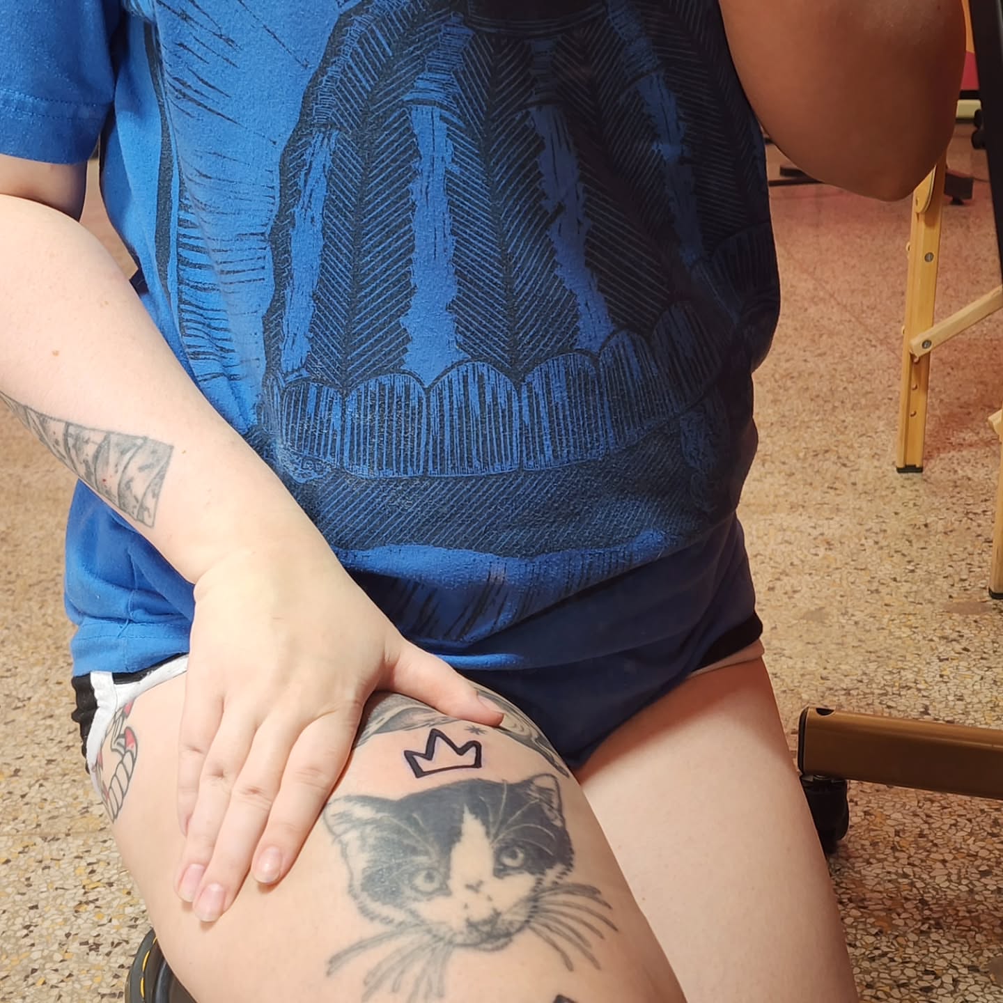 Cat black and grey tattoo on the thigh by K.F. Golden