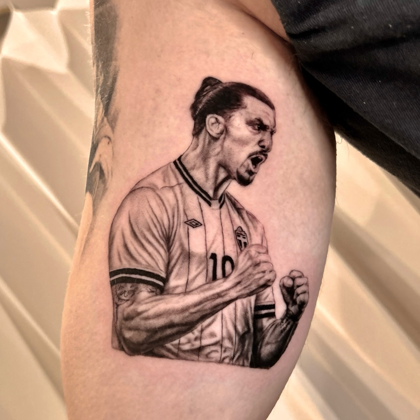 Soccer player realism tattoo on the forearm by Longtea