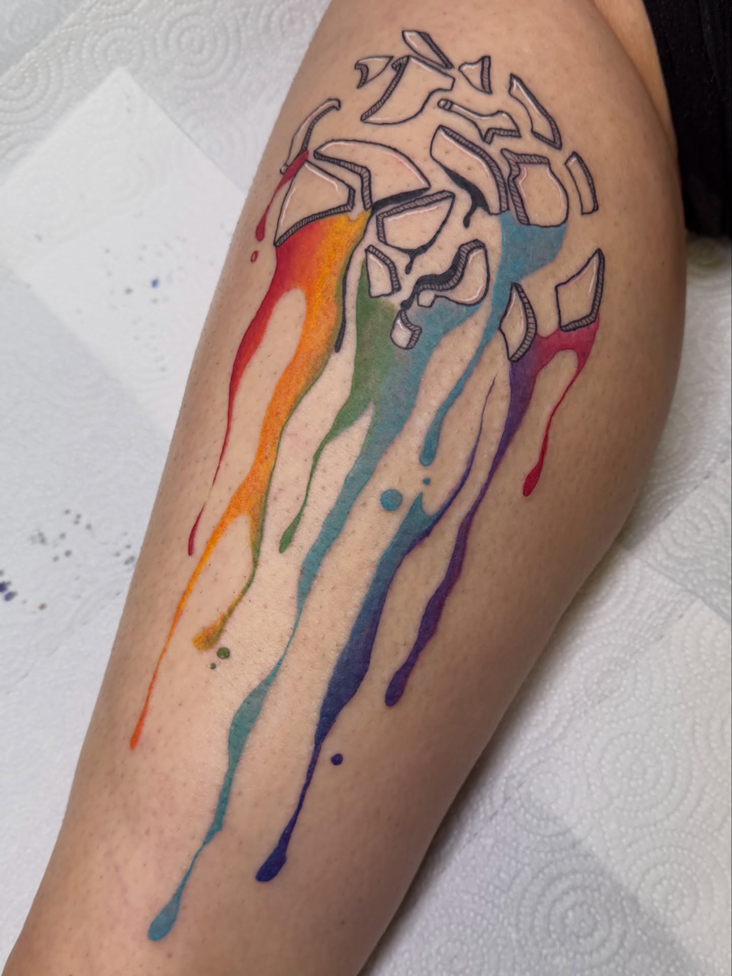 Rainbow skull new school tattoo on the forearm by Dani Fried Tattoos