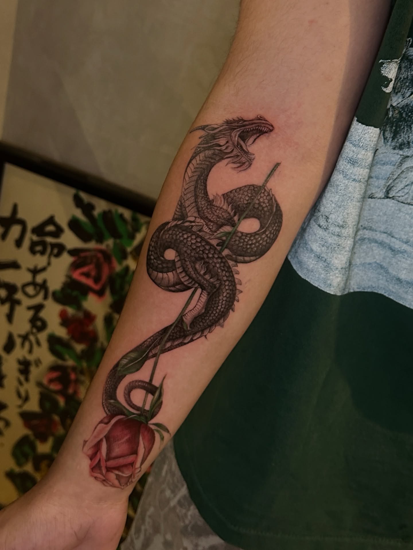 Dragon and rose realism tattoo on the forearm by Arhem Quiambao