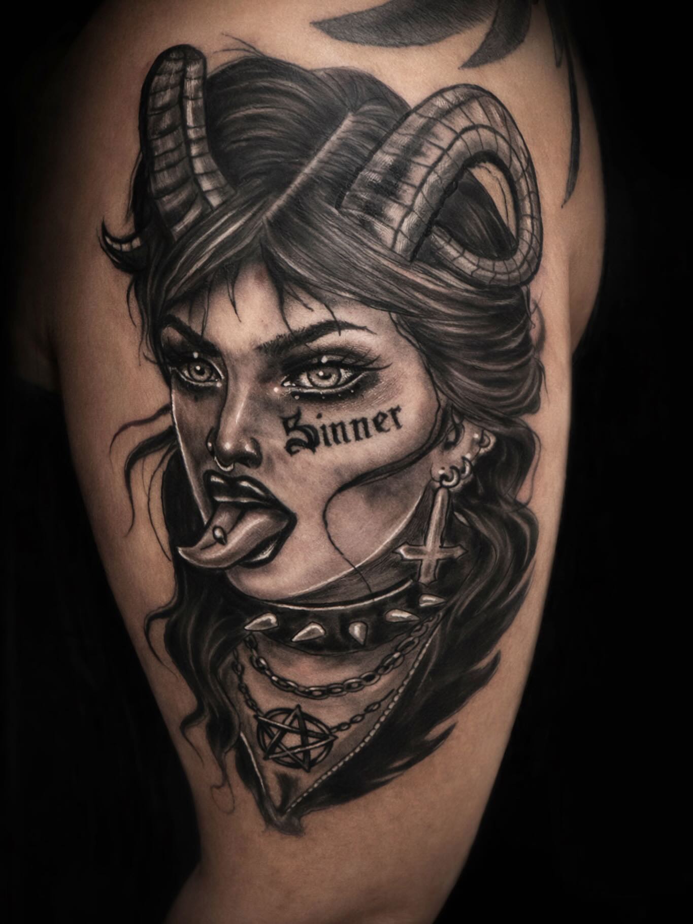 Woman with horns dark realism tattoo on the forearm by Salvador Mendoza, Sesto San Giovanni