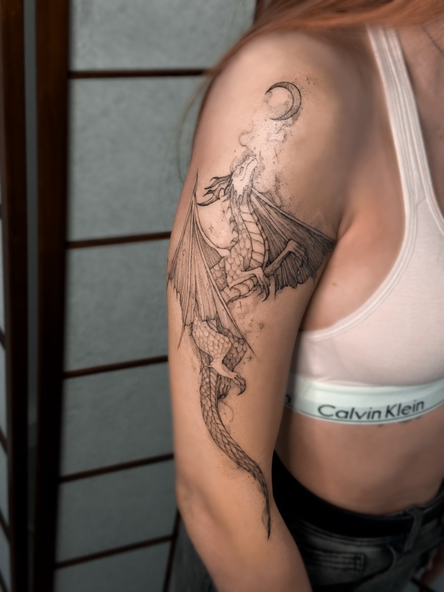 Dragon black and grey tattoo on the shoulder by Mila, Riga, Latvia