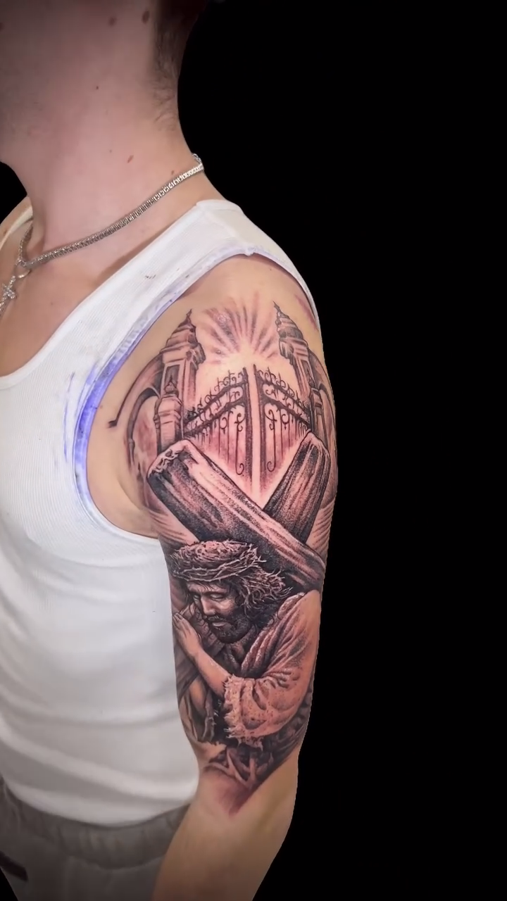 Jesus carrying the cross realism tattoo by Daniel Fisher, Berlin, New Jersey