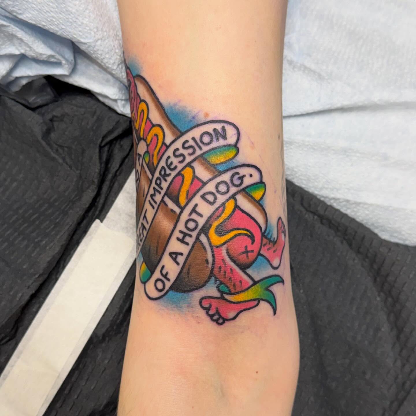Hot dog American traditional tattoo on the forearm by Matt Paw
