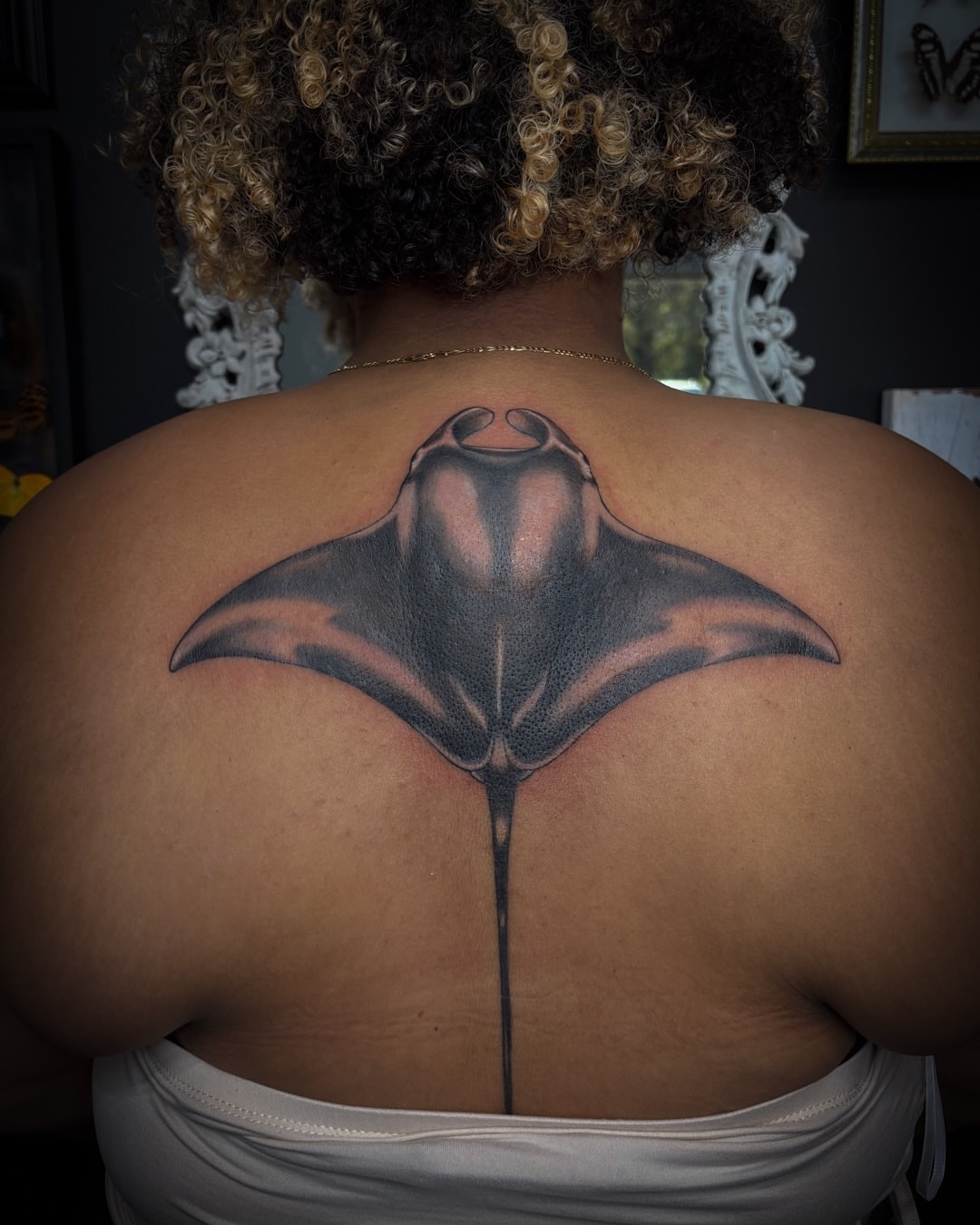 Ray black and grey tattoo on the back by Shiann Null