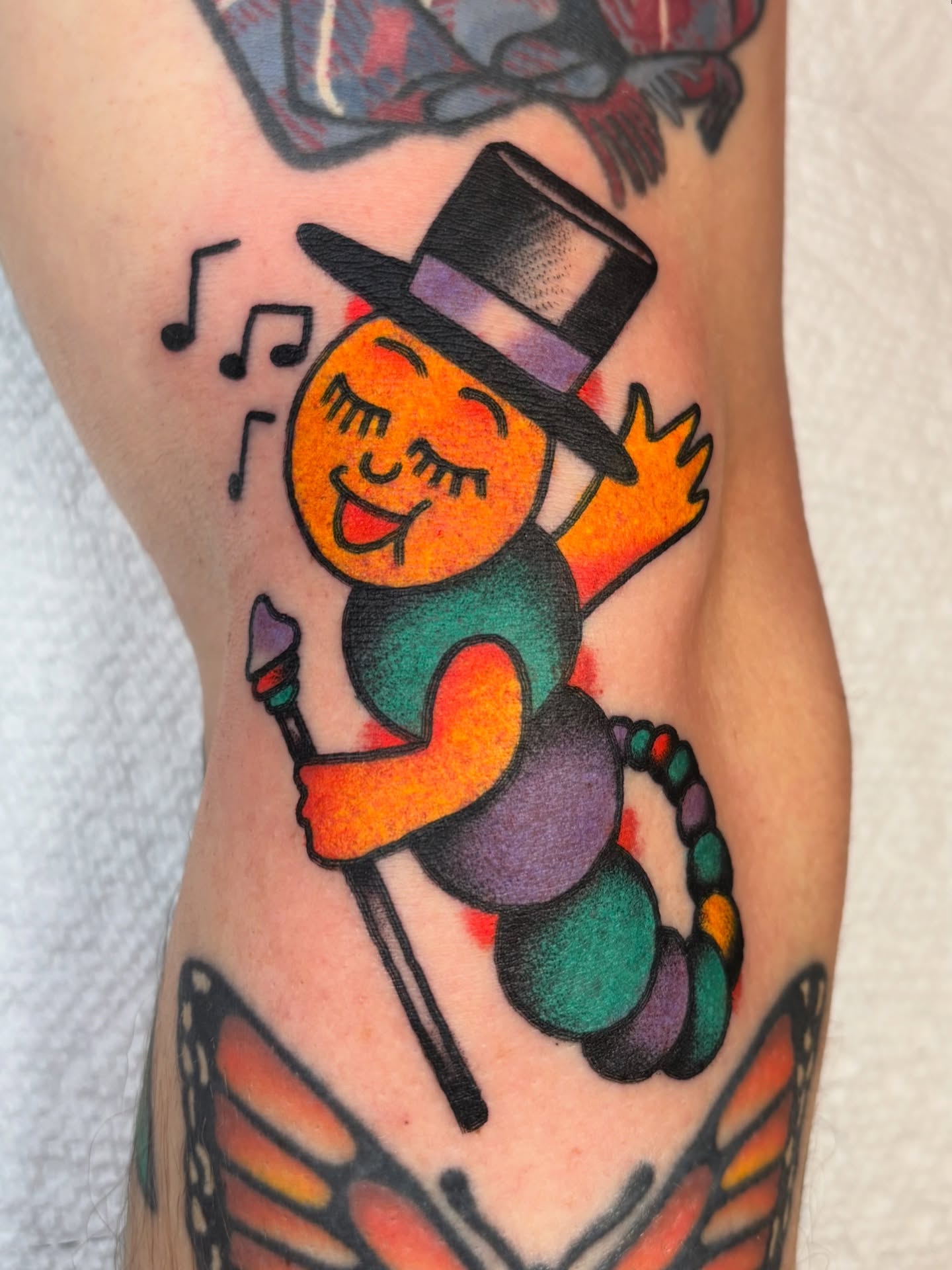 Clown American traditional tattoo on the forearm by Charlie Dunkel Tattoo