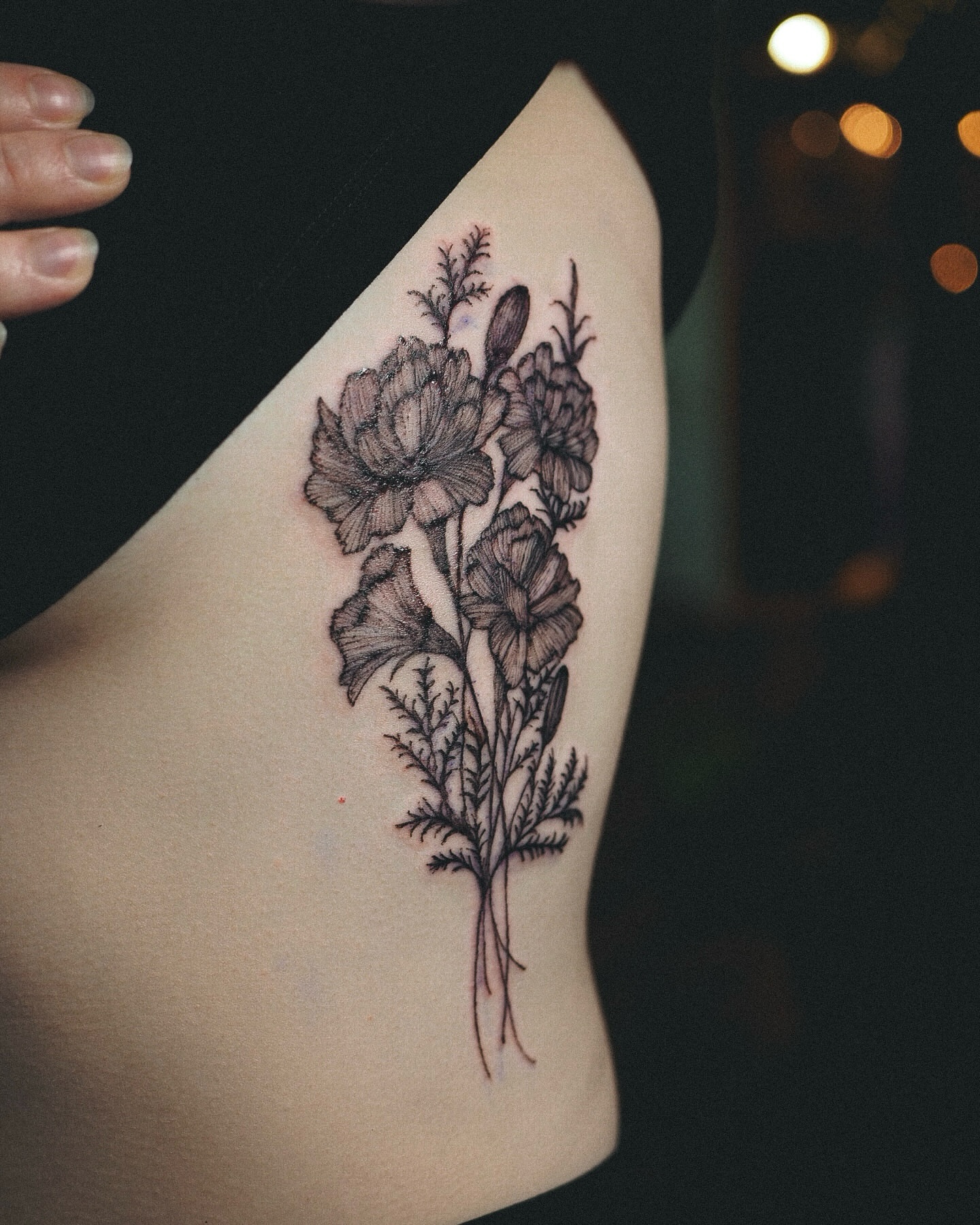 Flowers black and grey tattoo on the ribs by Inks by Nastia