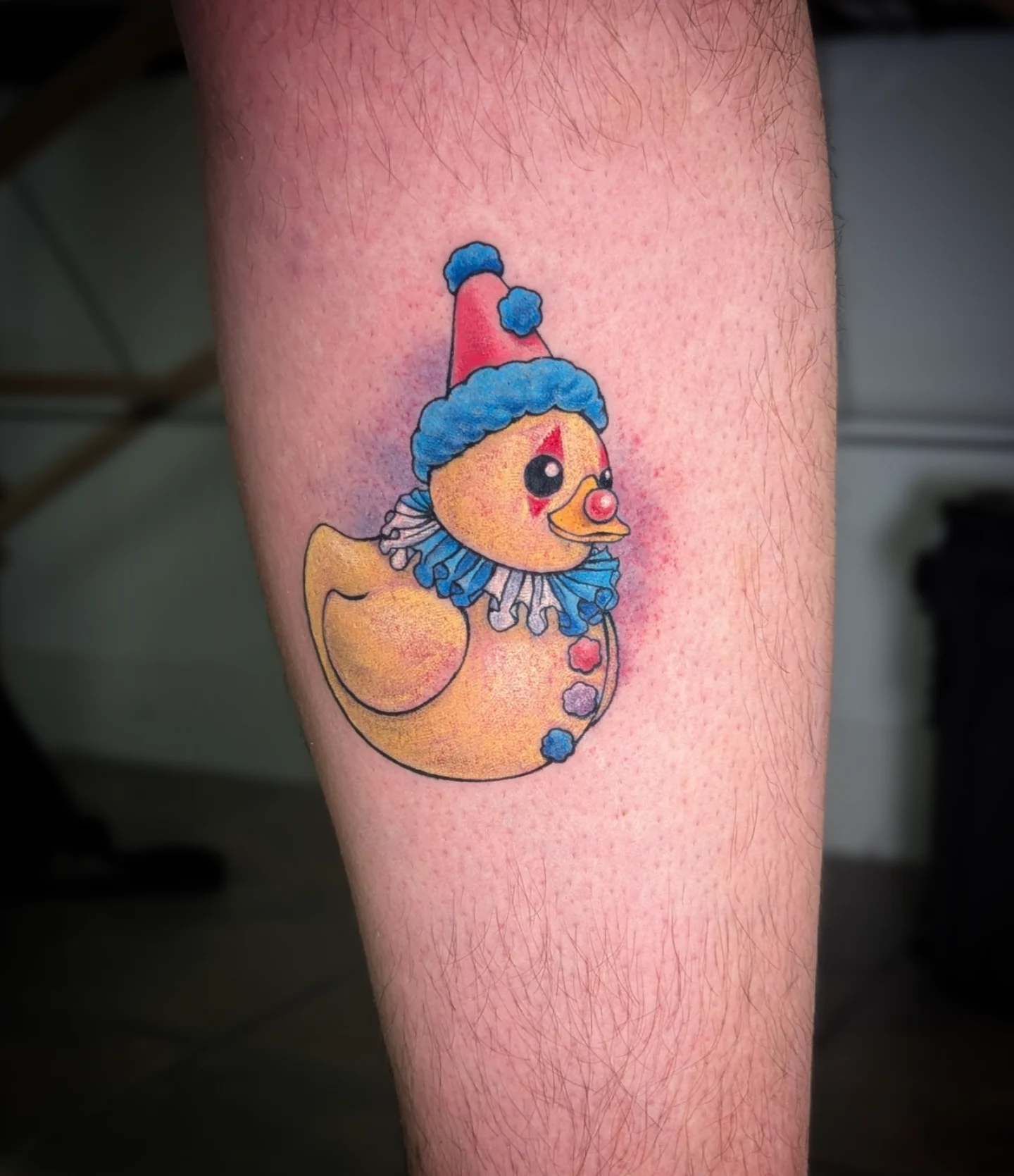 Clown duck dotwork tattoo on the forearm by Lorelei