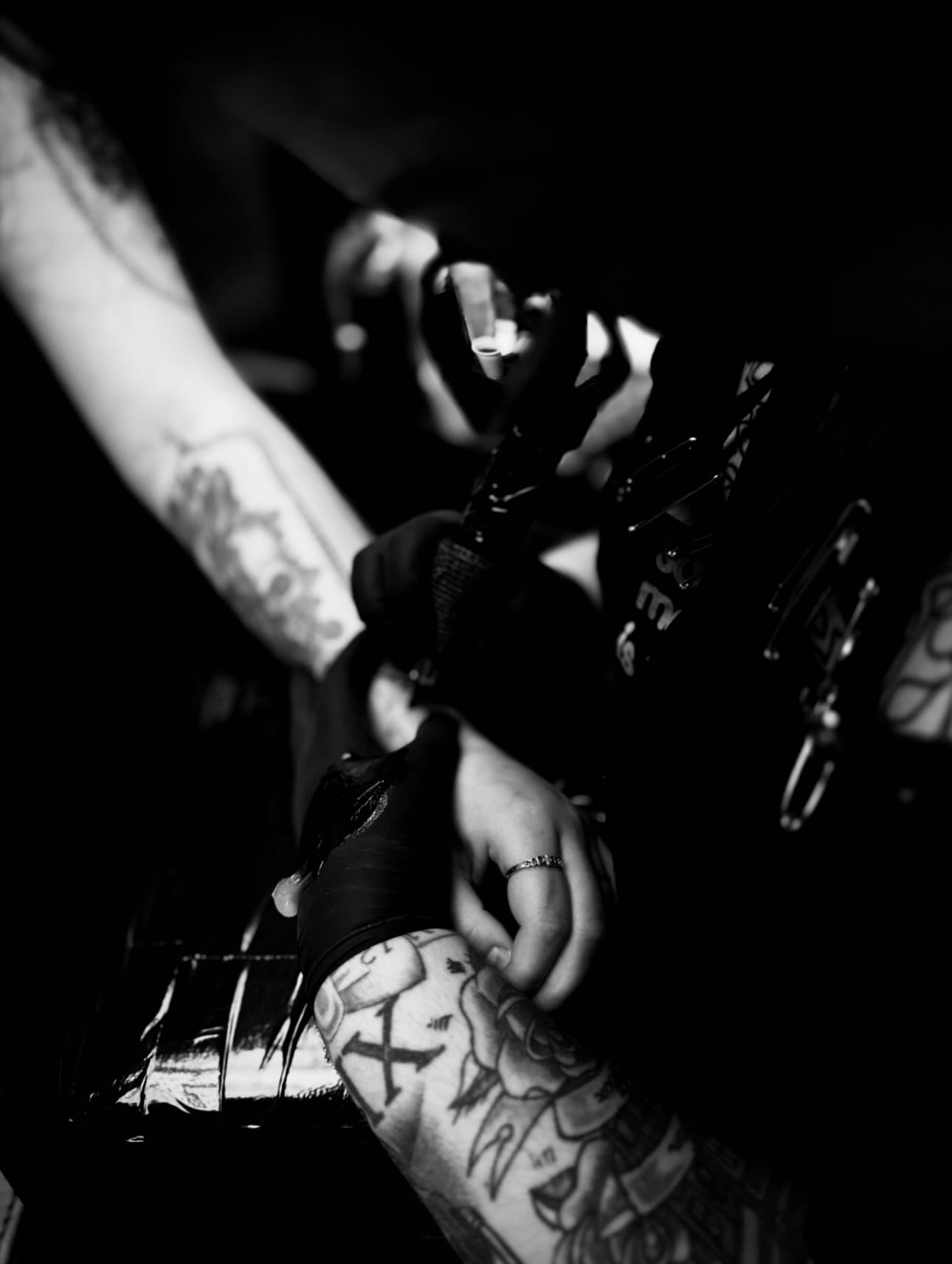Tattooed hands black and grey tattoo on the upper arm by Katelyn Arnold