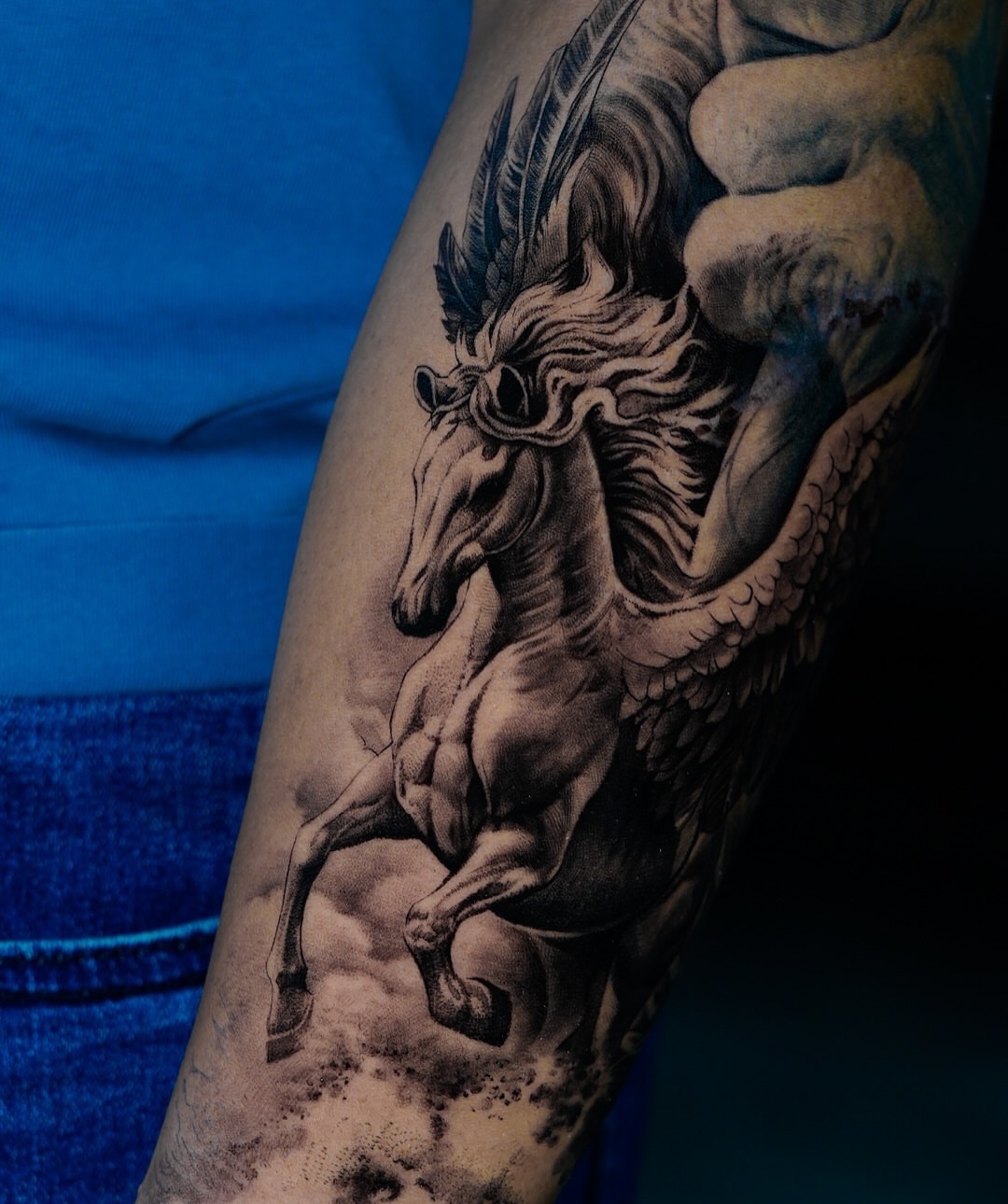Pegasus realism tattoo on the forearm by Elisha Kane