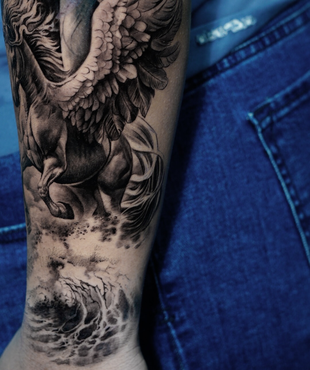 Pegasus realism tattoo on the forearm by Elisha Kane