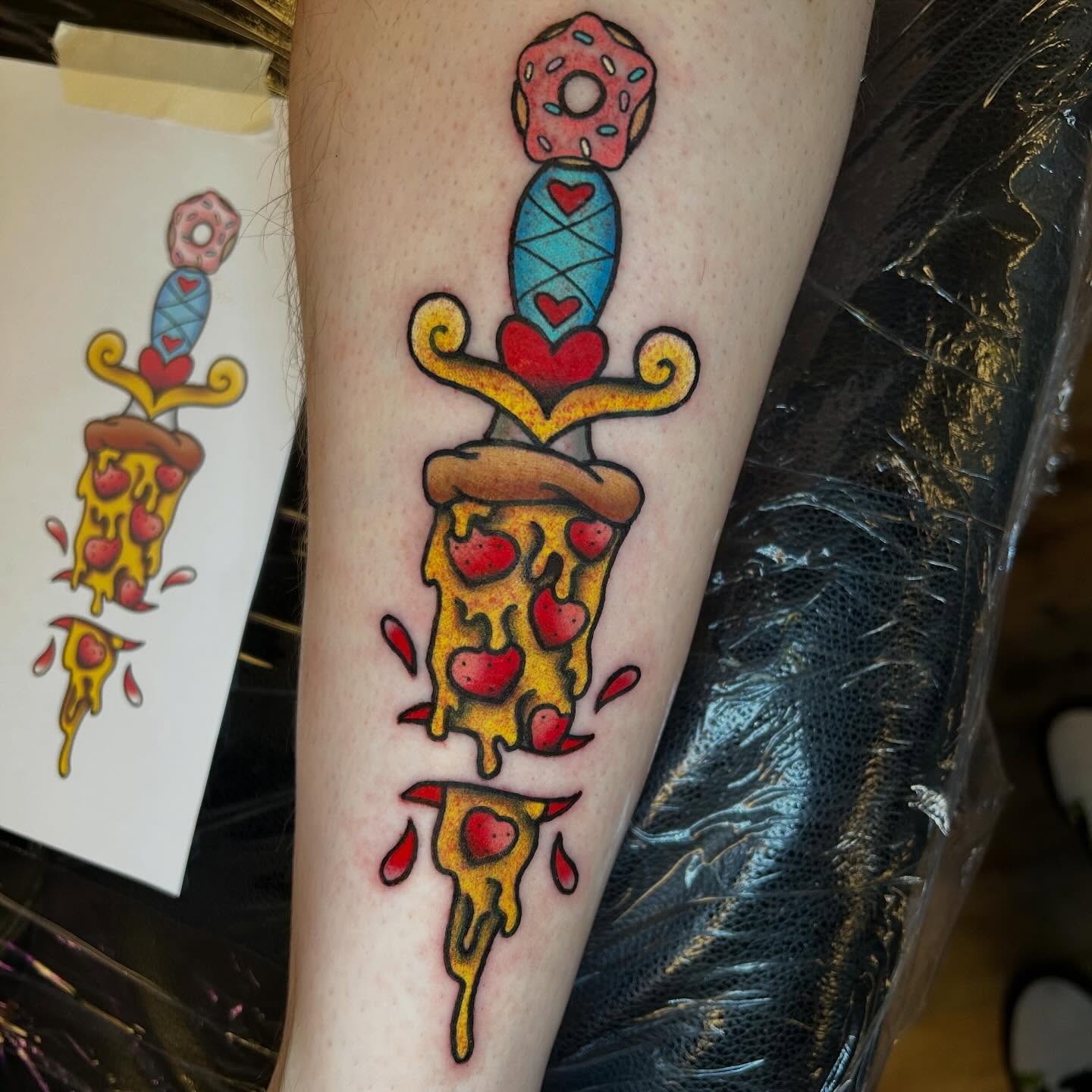 Pizza slice American traditional tattoo on the forearm by Alexis Skye