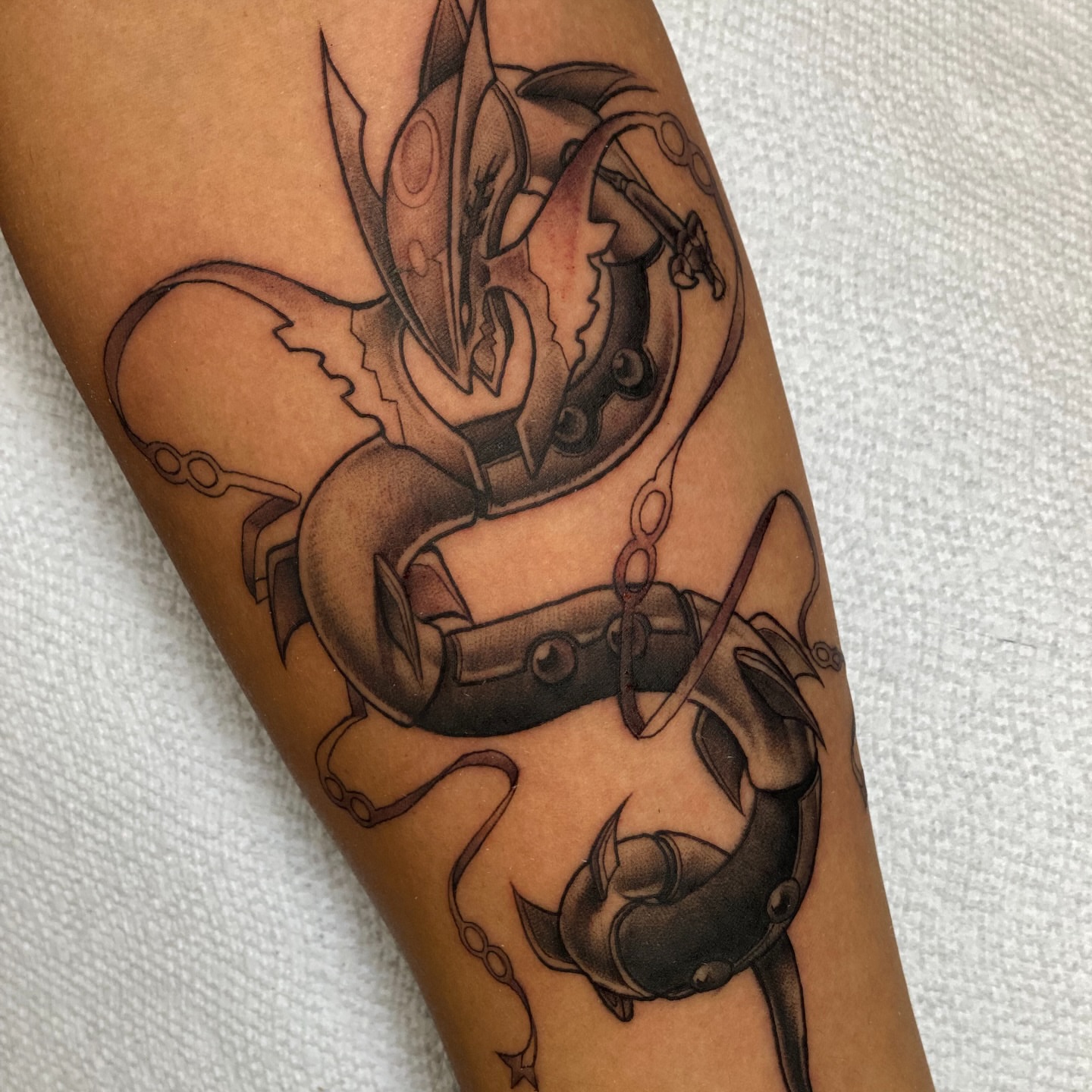 Mecha black and grey tattoo on the forearm by Seth Mullin, Hemet, California