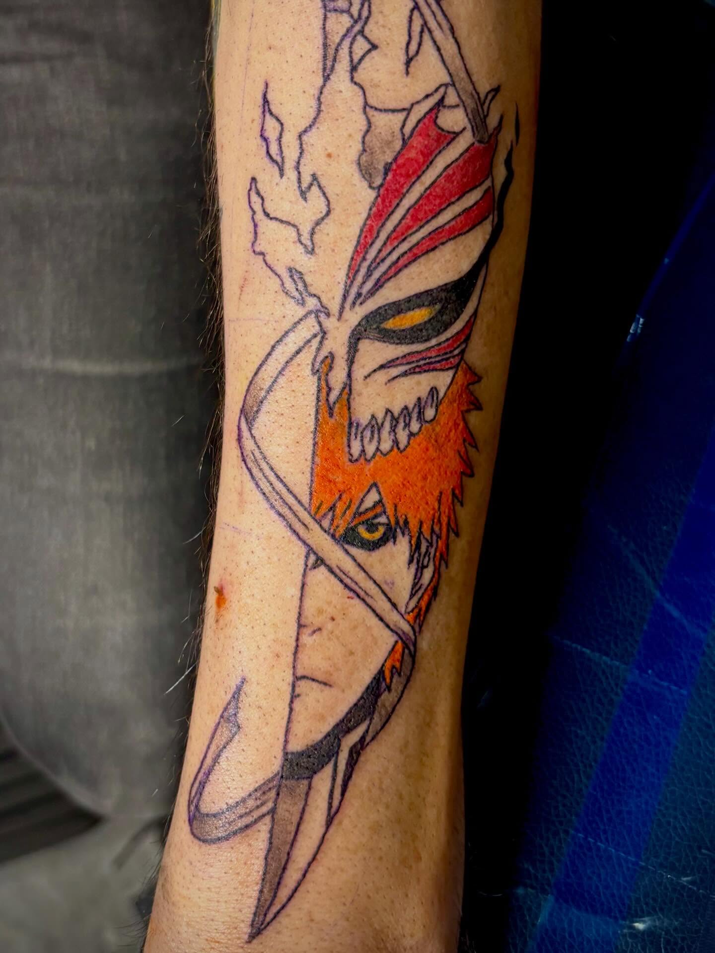 Anime character anime tattoo on the forearm by Rayne