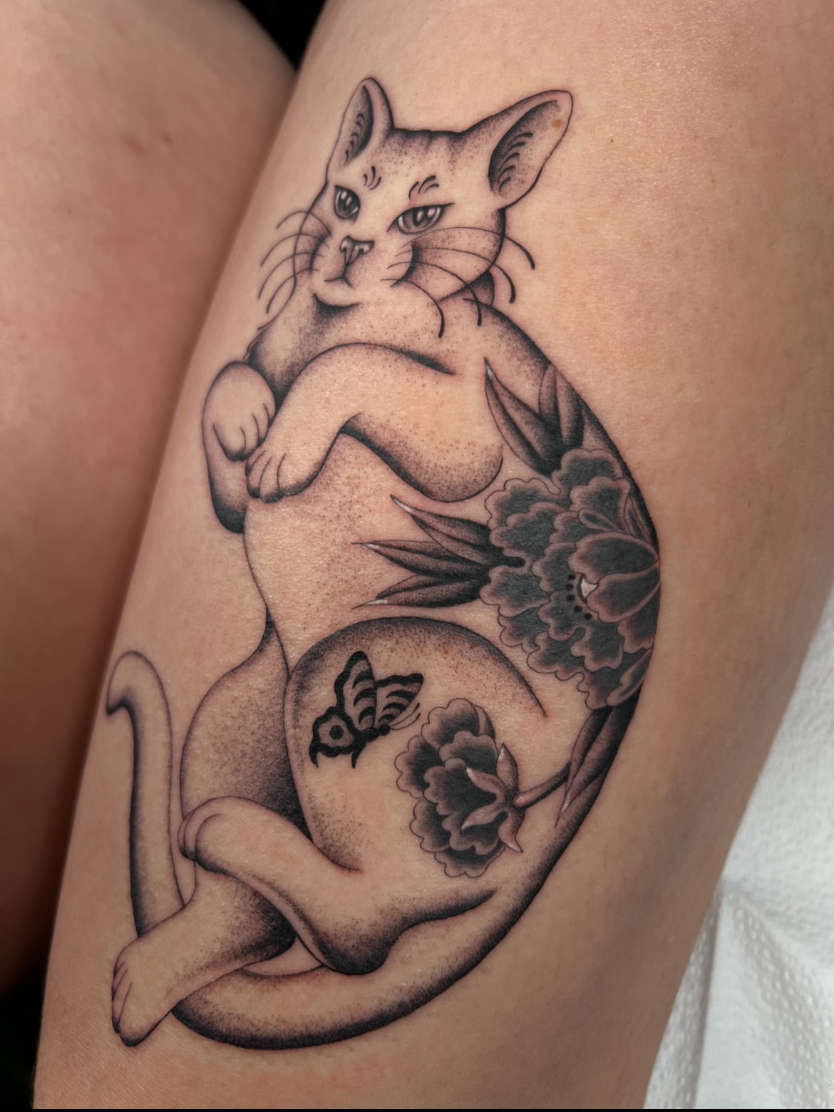 Fat cat realism tattoo on the thigh by Cassidy Maples