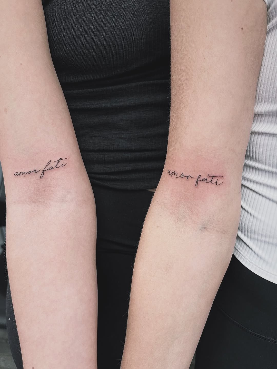 Amor fati script lettering tattoo on the forearm by 𝚁𝚒𝚌𝚑𝚊𝚛𝚍