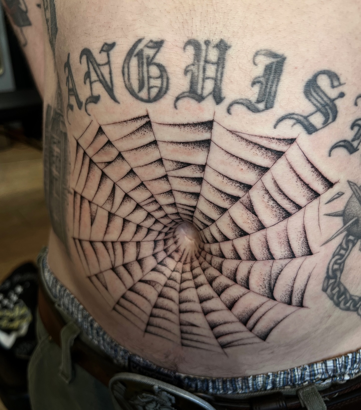 Spiral dotwork tattoo on the torso by David Delacruz