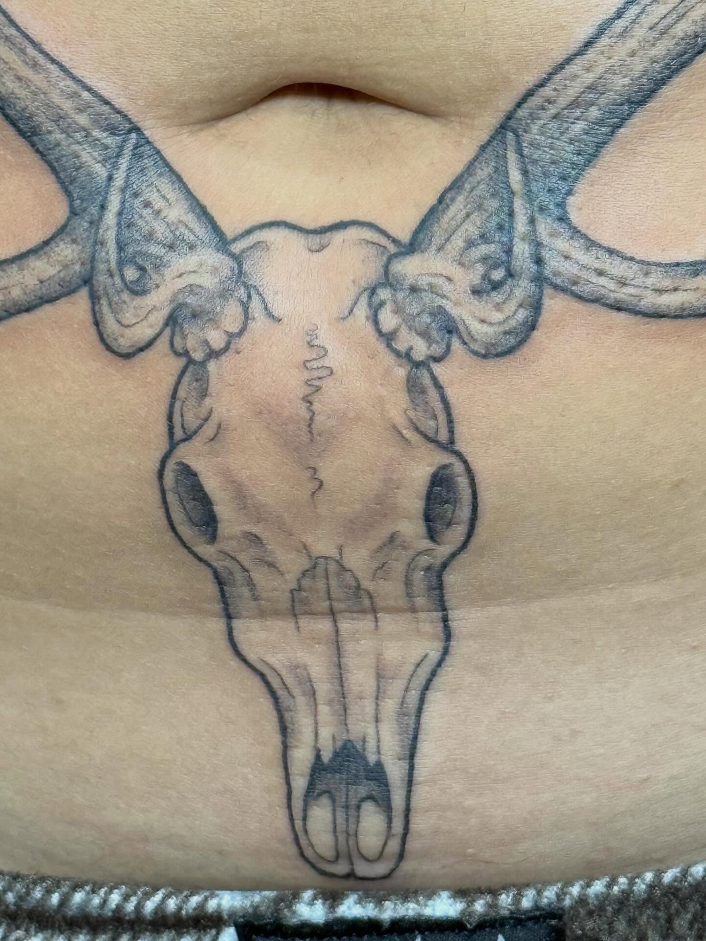 Deer skull black and grey tattoo on the chest by Camryn Justice