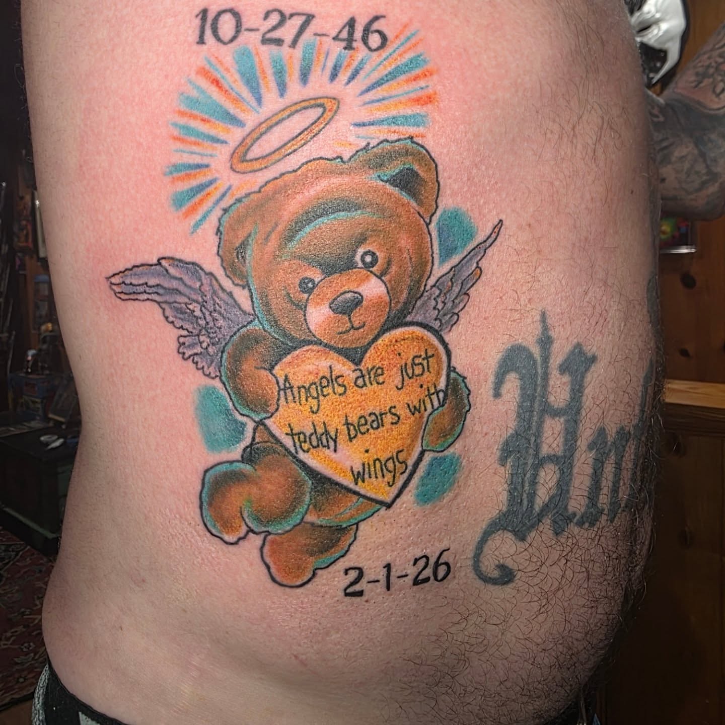 Teddy bear with wings American traditional tattoo on the ribs by Rusty Williams