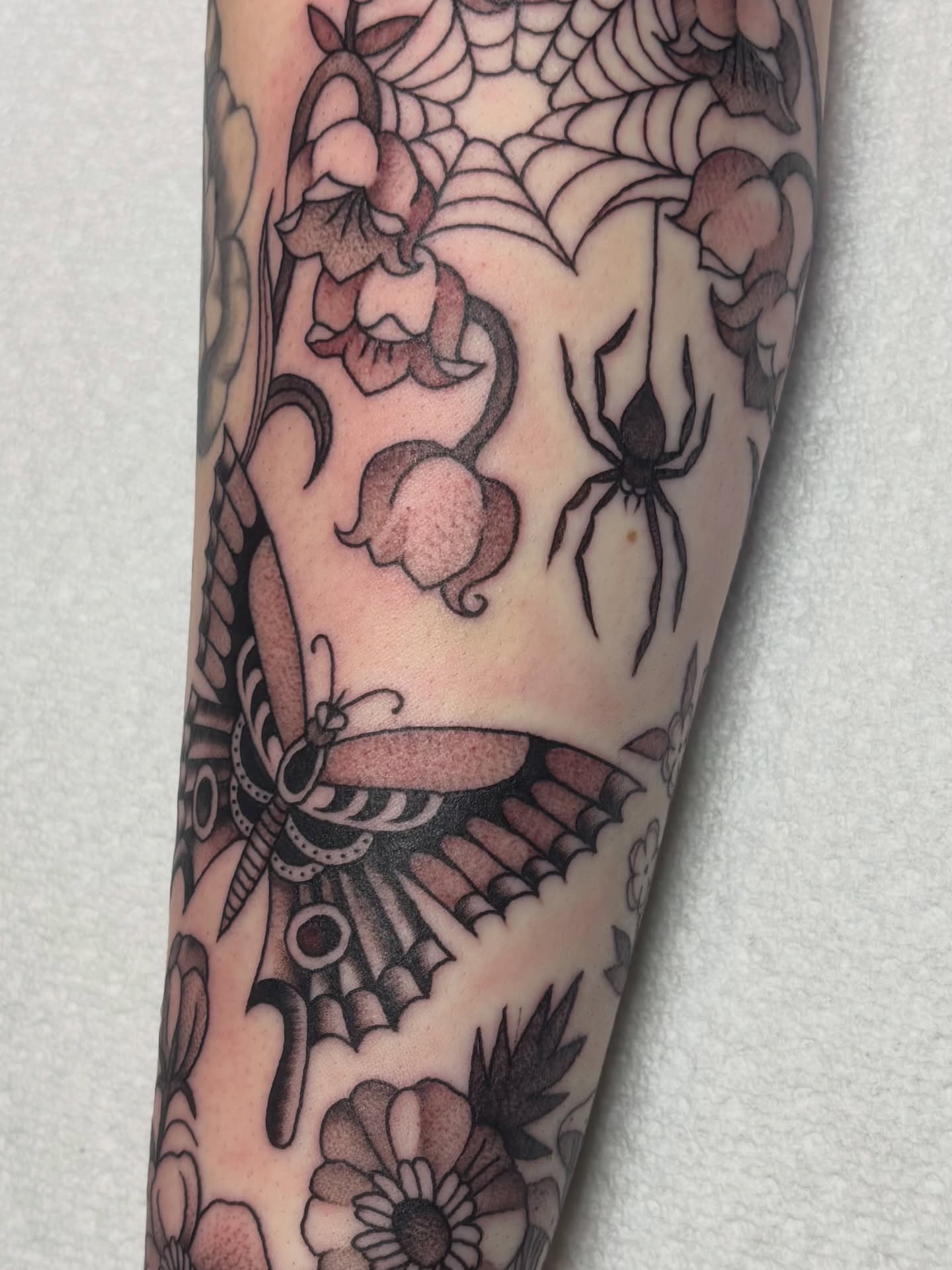 Butterfly and flowers American traditional tattoo on the forearm by edith🌷, Murfreesboro, Tennessee