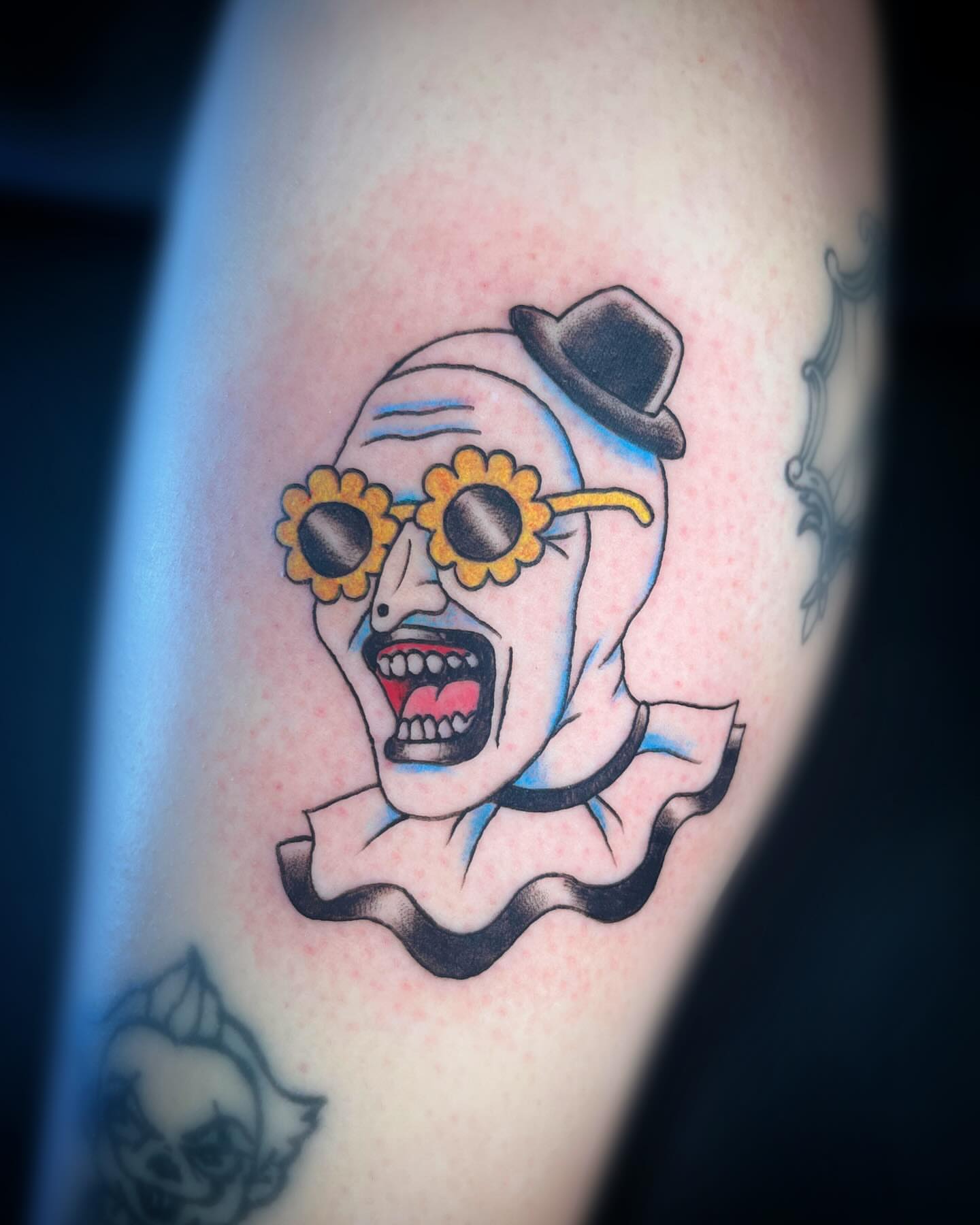 Clown head American traditional tattoo on the forearm by Saint