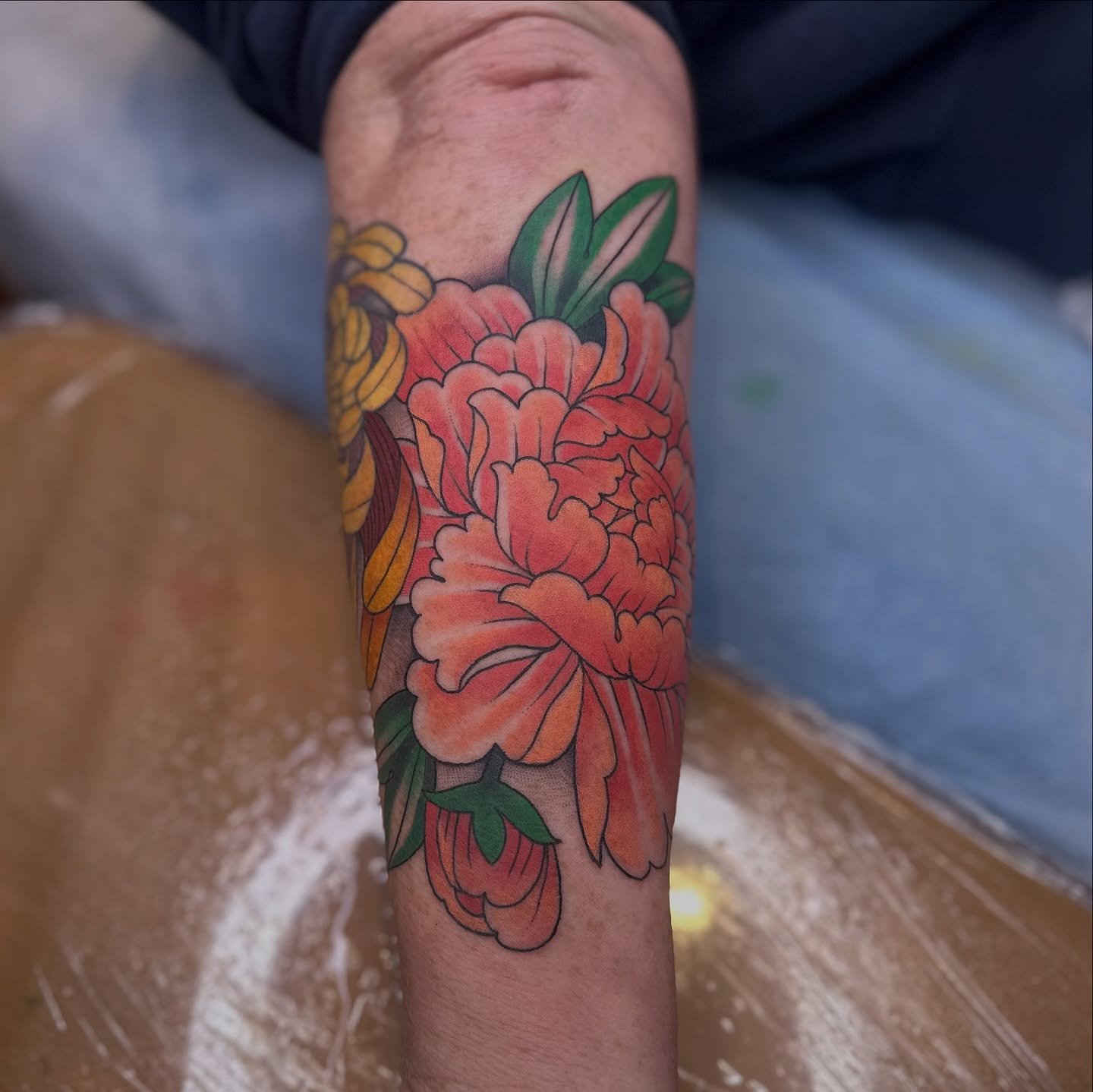 Peony American traditional tattoo on the forearm by Brieana Smith