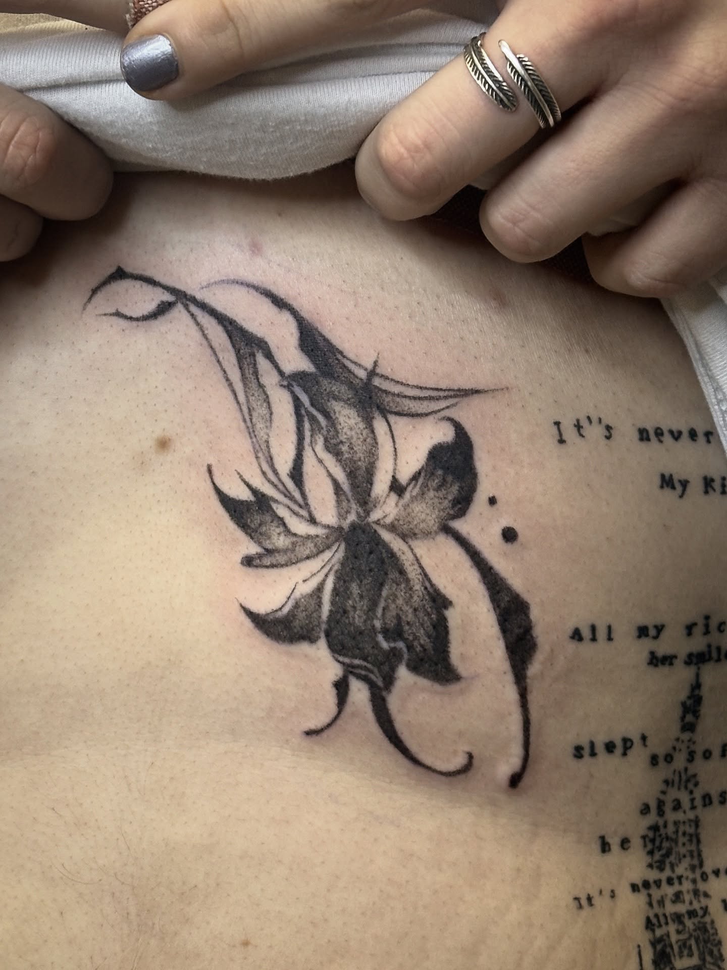Lily black and grey tattoo on the chest by ★ Val! ★ Tattoo Artist