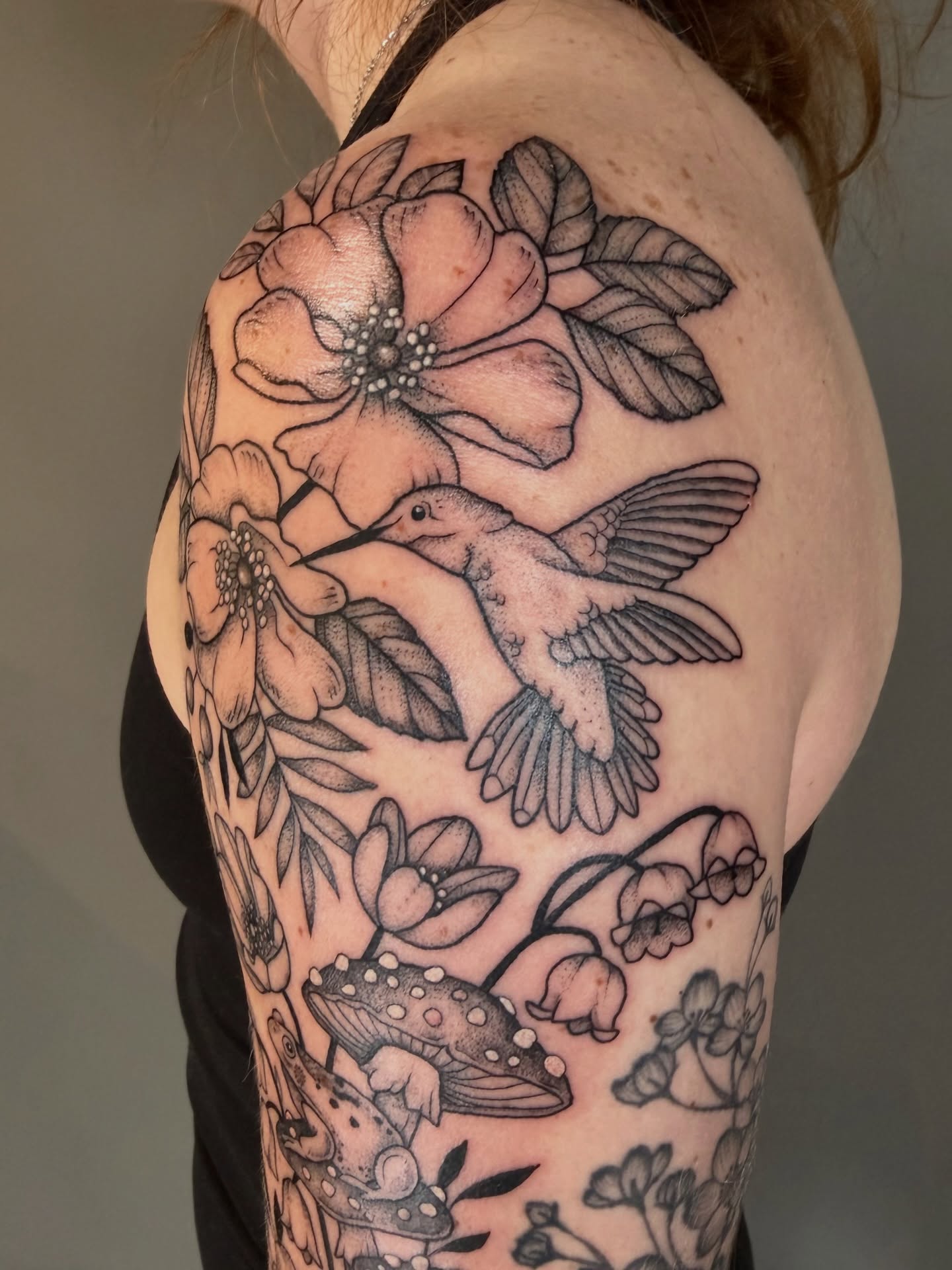 Hummingbird and flowers dotwork tattoo on the shoulder by Hannah, Portland, Oregon