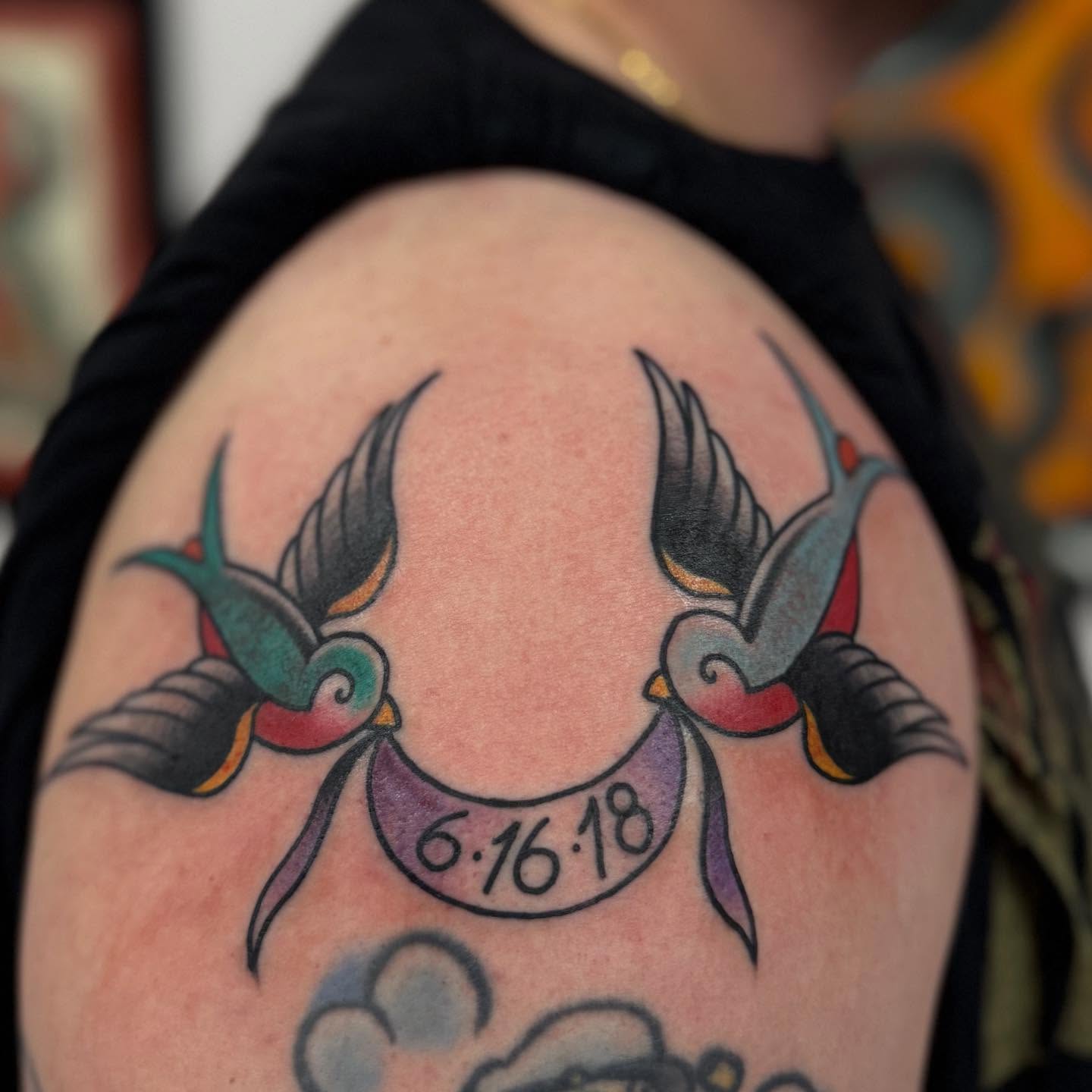 Swallows and date American traditional tattoo on the shoulder by Jason Eisenberg