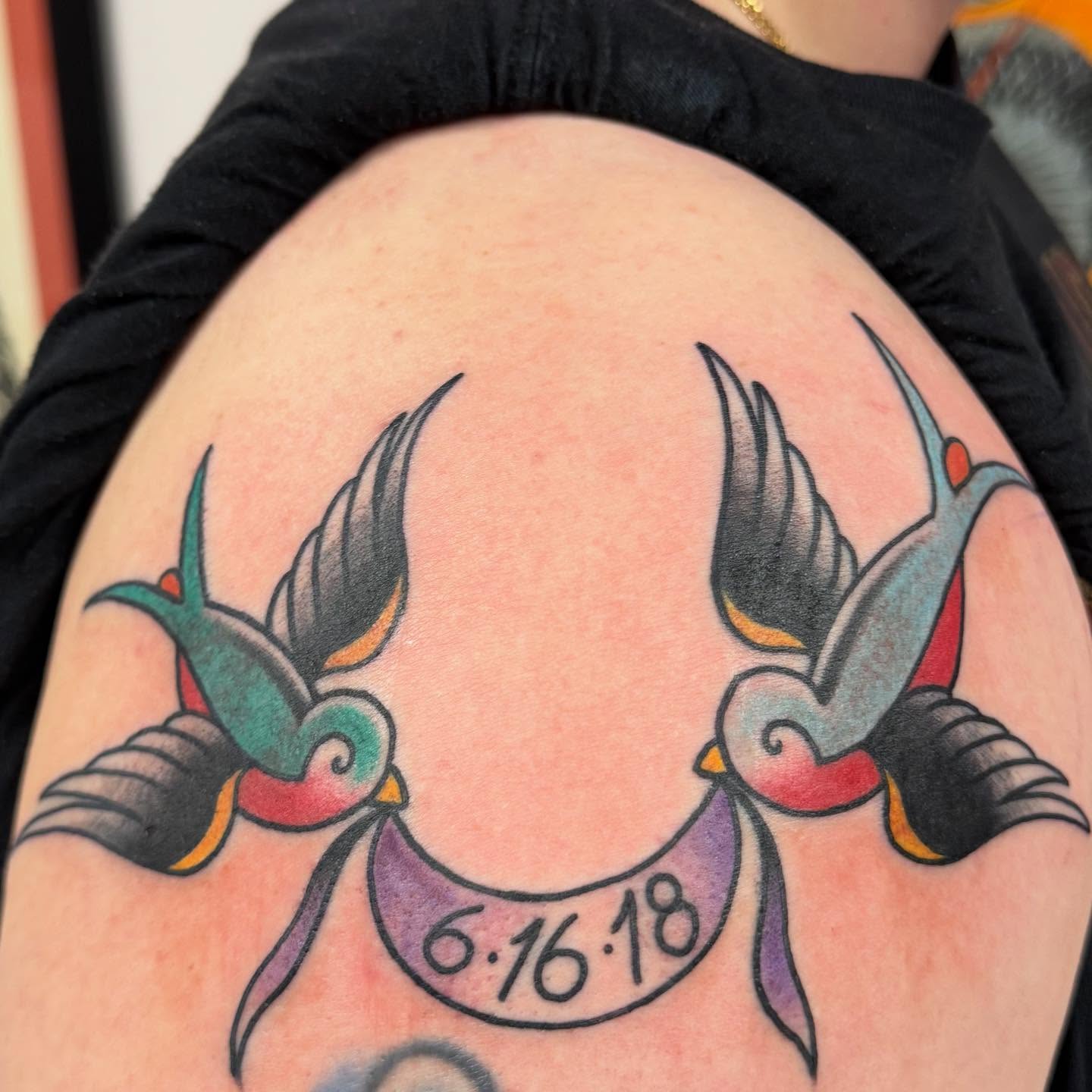 Swallows and banner American traditional tattoo on the shoulder by Jason Eisenberg