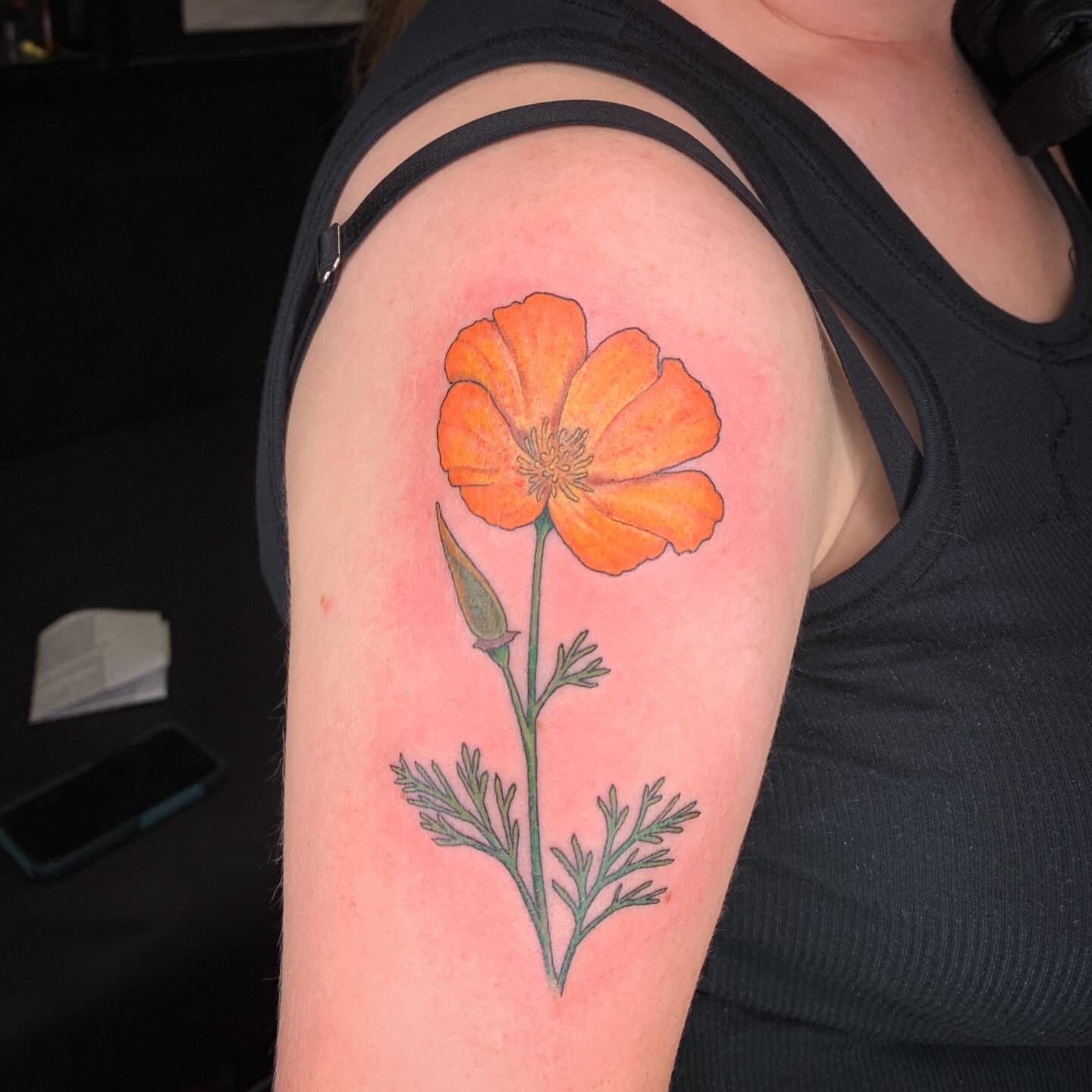 California poppy realism tattoo on the shoulder by Kitty Jones, Berkeley, California