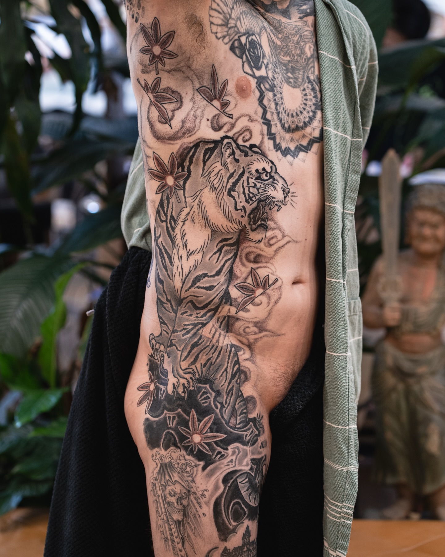 Tiger and floral American traditional tattoo on the forearm by James Fernella, San Francisco, California