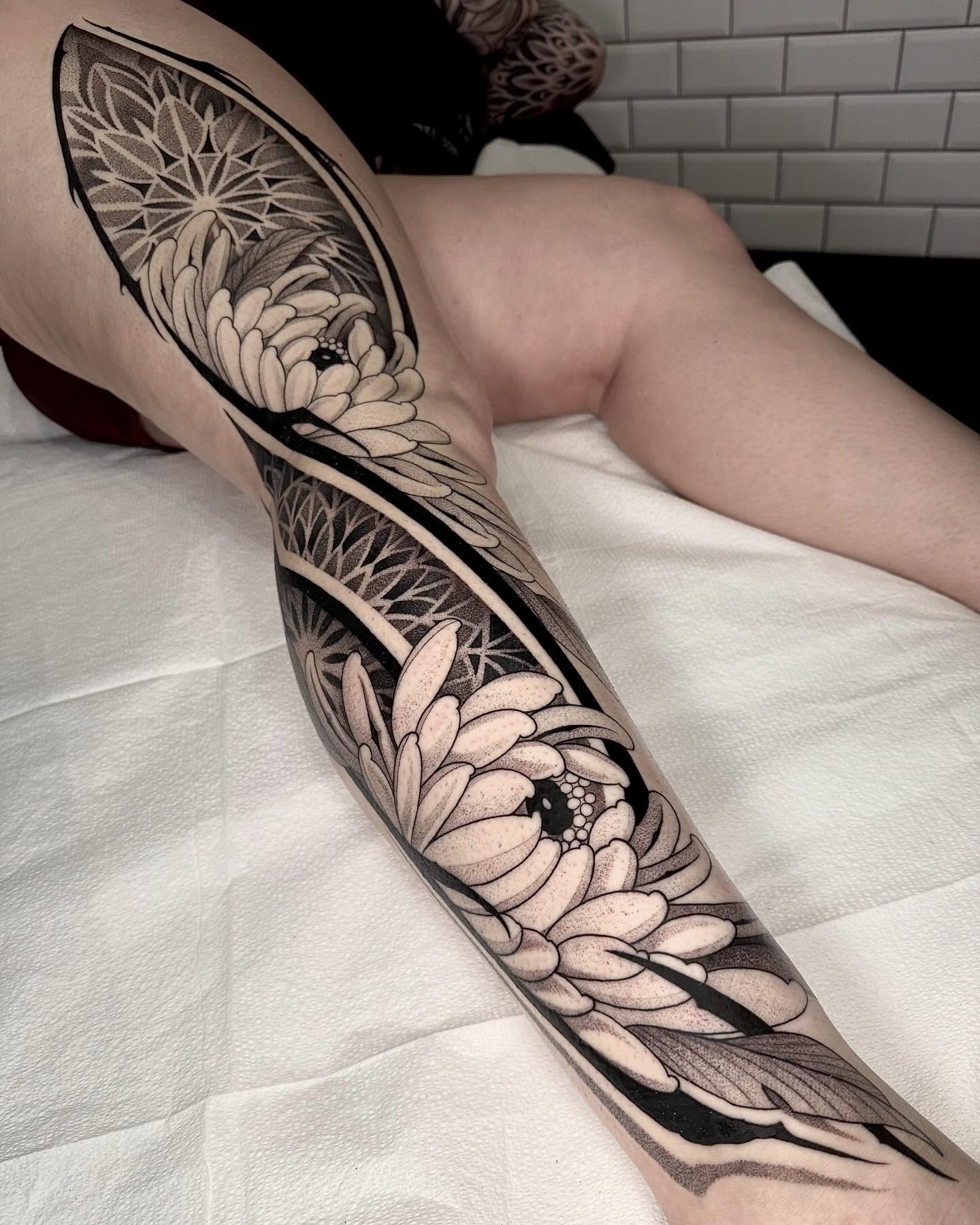 Chrysanthemum dotwork tattoo on the forearm by Kevin Johnson